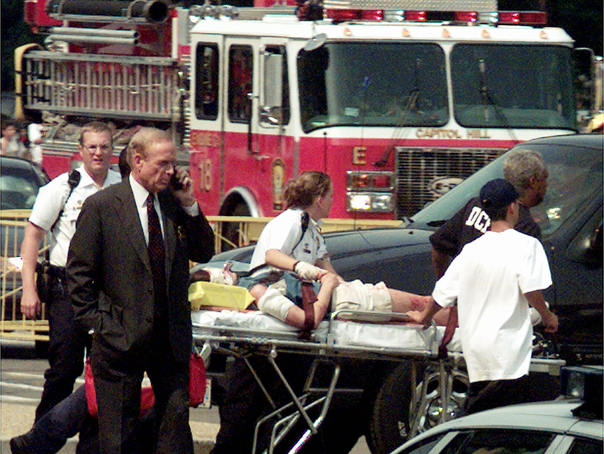FILE - In this July 24, 1998, file photo, an unidentified victim is rushed to a helicopter on Capitol Hill in Washington. Two policemen died late in an exchange of gunfire at a checkpoint inside the Capitol, officials said. (AP Photo/Joe Marquette, File)