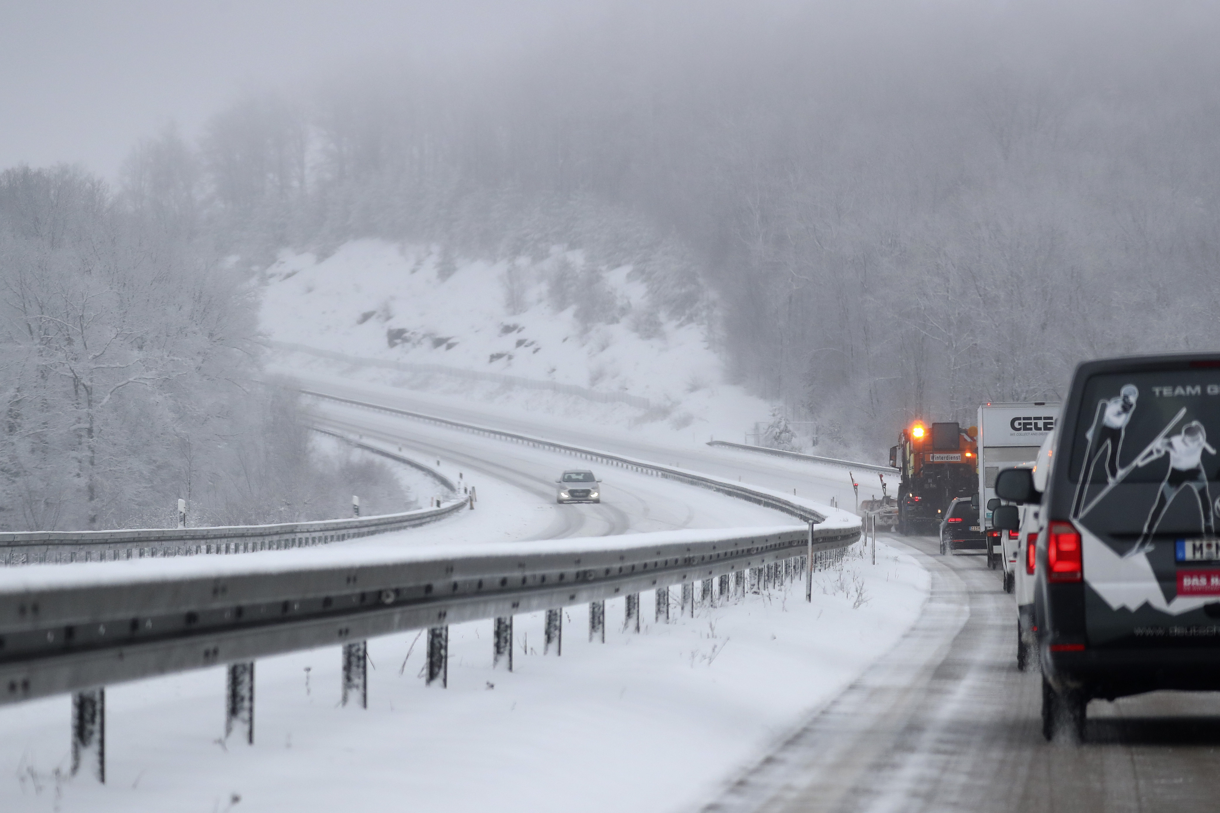 A car makes his way on motorway 73 between Schleusingen and Eisfeld near Suhl, Germany, Tuesday, Jan. 12, 2021. Snow and ice have caused disruptions in parts of northern Bavaria and southern Thuringia. (AP Photo/Matthias Schrader)