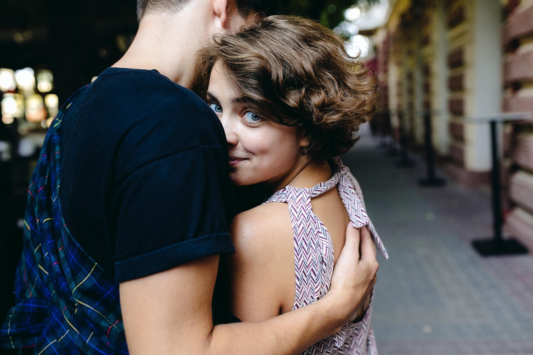 Portrait of a happy couple hugging in the street with the woman face in foreground,Image: 316244525, License: Royalty-free, Restrictions: , Model Release: yes, Credit line: Oleksii Hrecheniuk / Alamy / Alamy / Profimedia