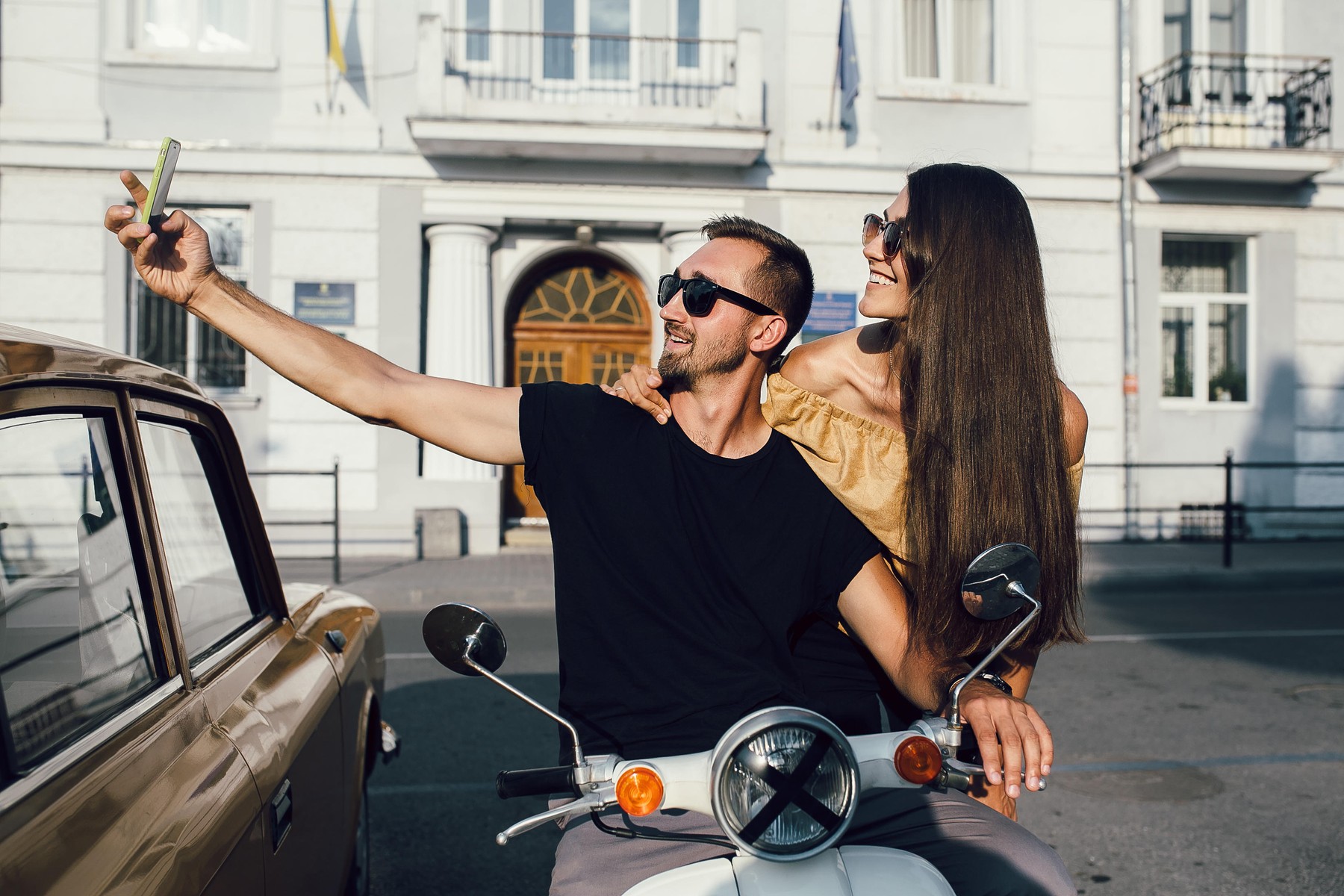 Cute couple make selfie on a scooter at sunny day in the city,Image: 312316618, License: Royalty-free, Restrictions: , Model Release: yes, Credit line: Oleksii Hrecheniuk / Alamy / Alamy / Profimedia