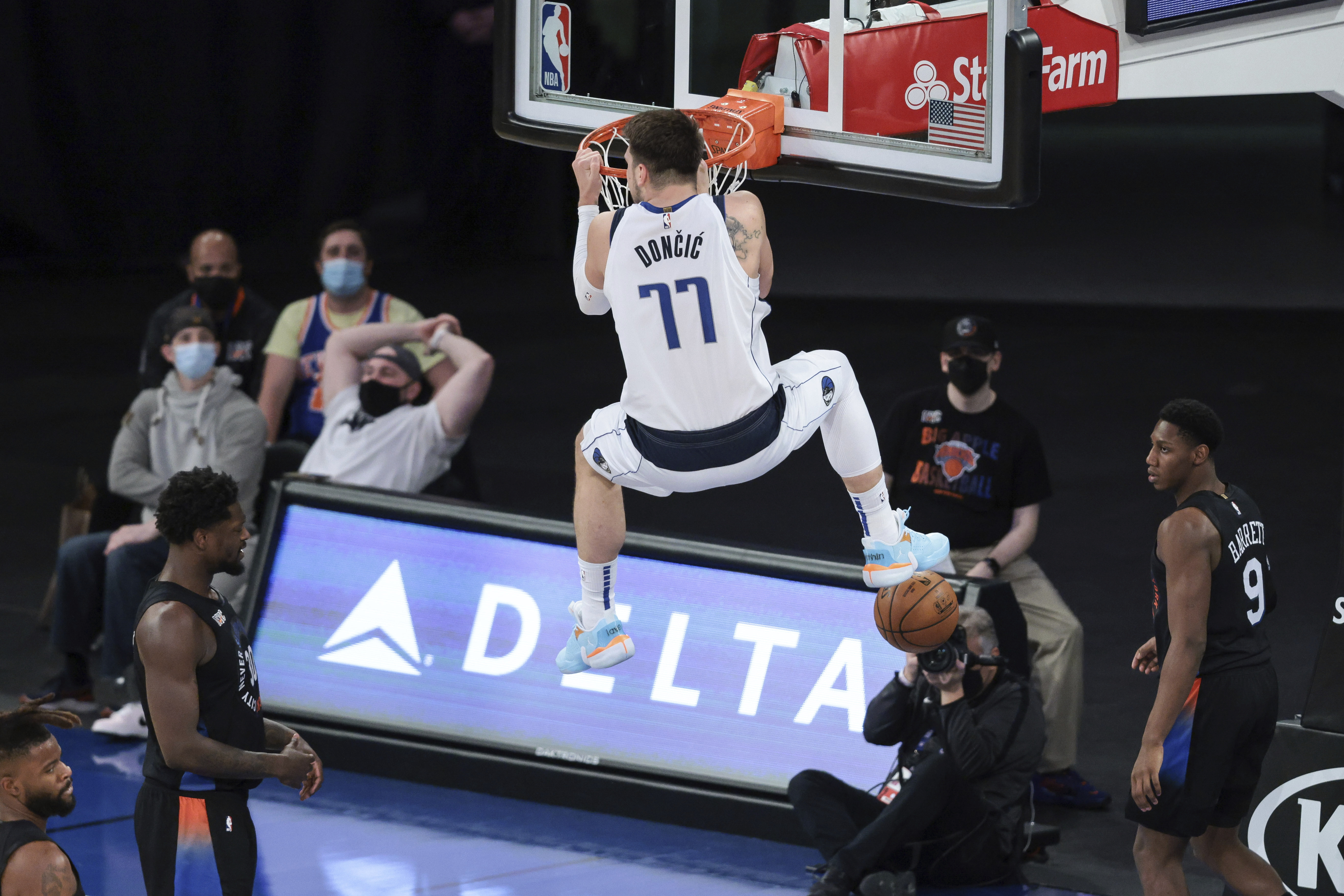 Dallas Mavericks guard Luka Doncic (77) dunks during the second half against the New York Knicks in an NBA basketball game Friday, April 2, 2021, in New York. (Vincent Carchietta/Pool Photo via AP)