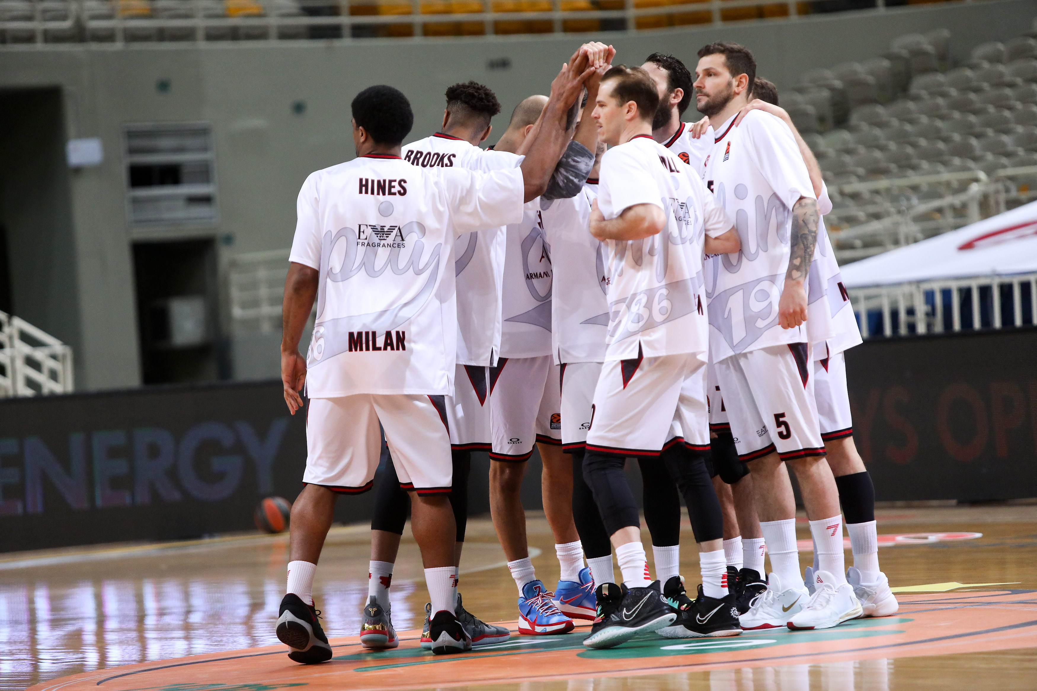 epa09111073 Players of AX Armani Exchange Milan before the start of the Euroleague Basketball match between Panathinaikos OPAP Athens and AX Armani Exchange Milan at the OAKA Stadium in Athens, Greece, 01 April 2021.  EPA-EFE/PETE ANDREOU