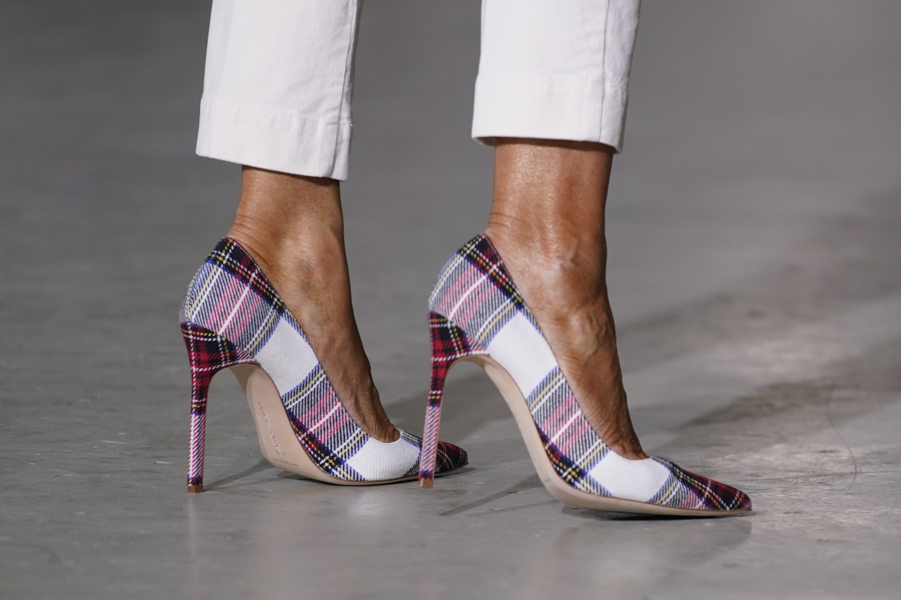 First lady Melania Trump shoes are seen as she participates in the U.S. Marine Corps Reserve's Toys for Tots Drive at Joint Base Anacostia-Bolling in Washington, Tuesday, Dec. 8, 2020. (AP Photo/Patrick Semansky)