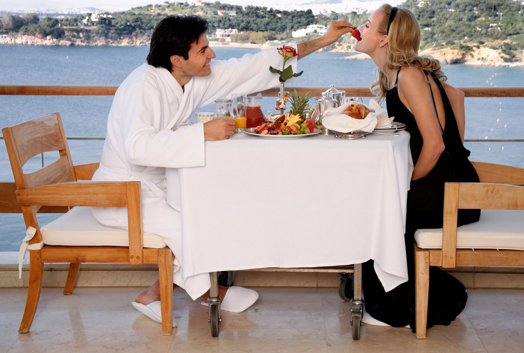 Couple having breakfast on hotel terrace
