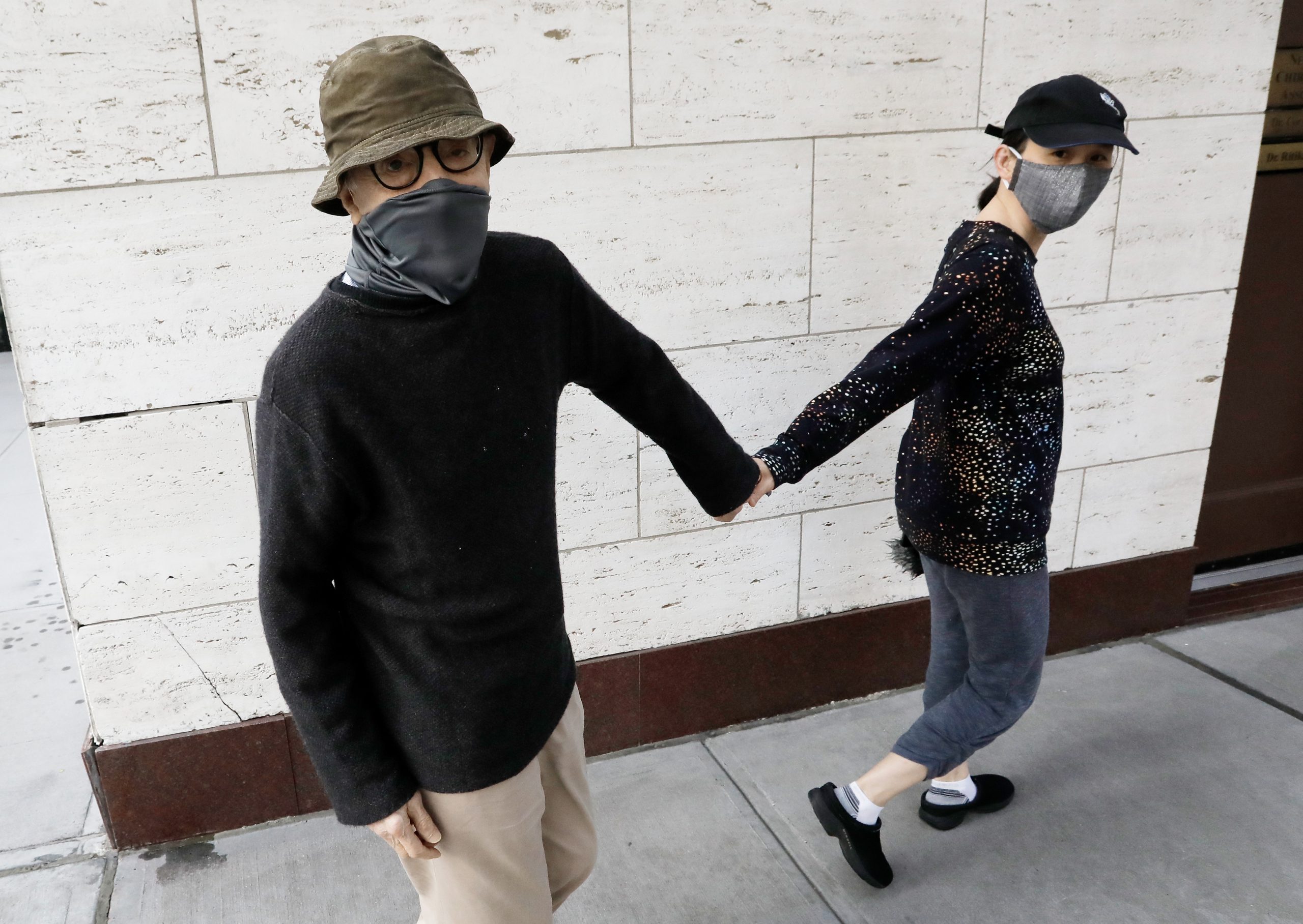epa08671655 US filmmaker Woody Allen (L) with his wife Soon Yi walk up Park Avenue in New York, New York, USA, 15 September 2020.  EPA-EFE/Peter Foley