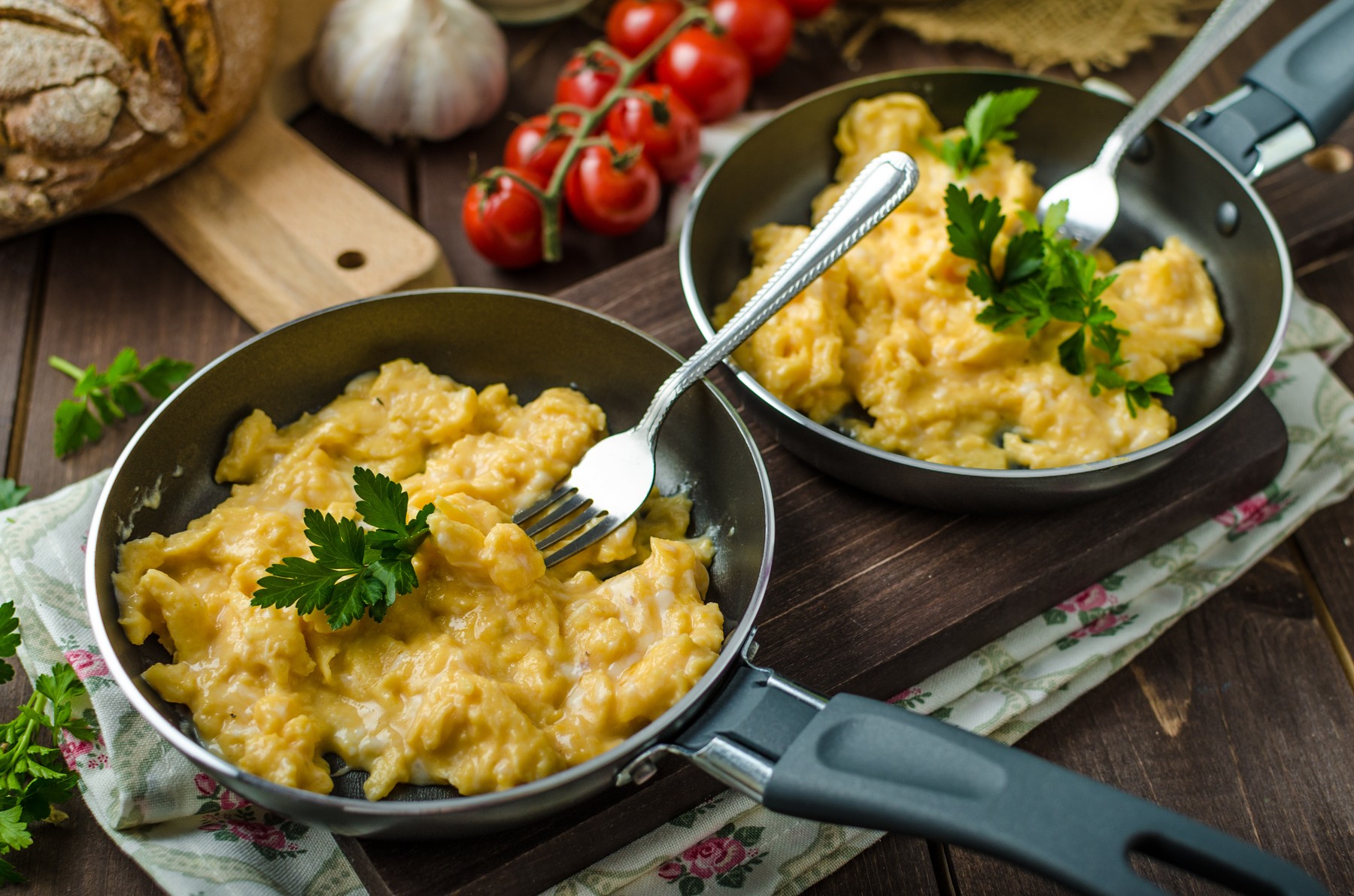 Scrambled eggs with herbs and homemade bread,  on two frying pans,Image: 528871417, License: Royalty-free, Restrictions: , Model Release: no, Credit line: Petr Štěpánek / Panthermedia / Profimedia