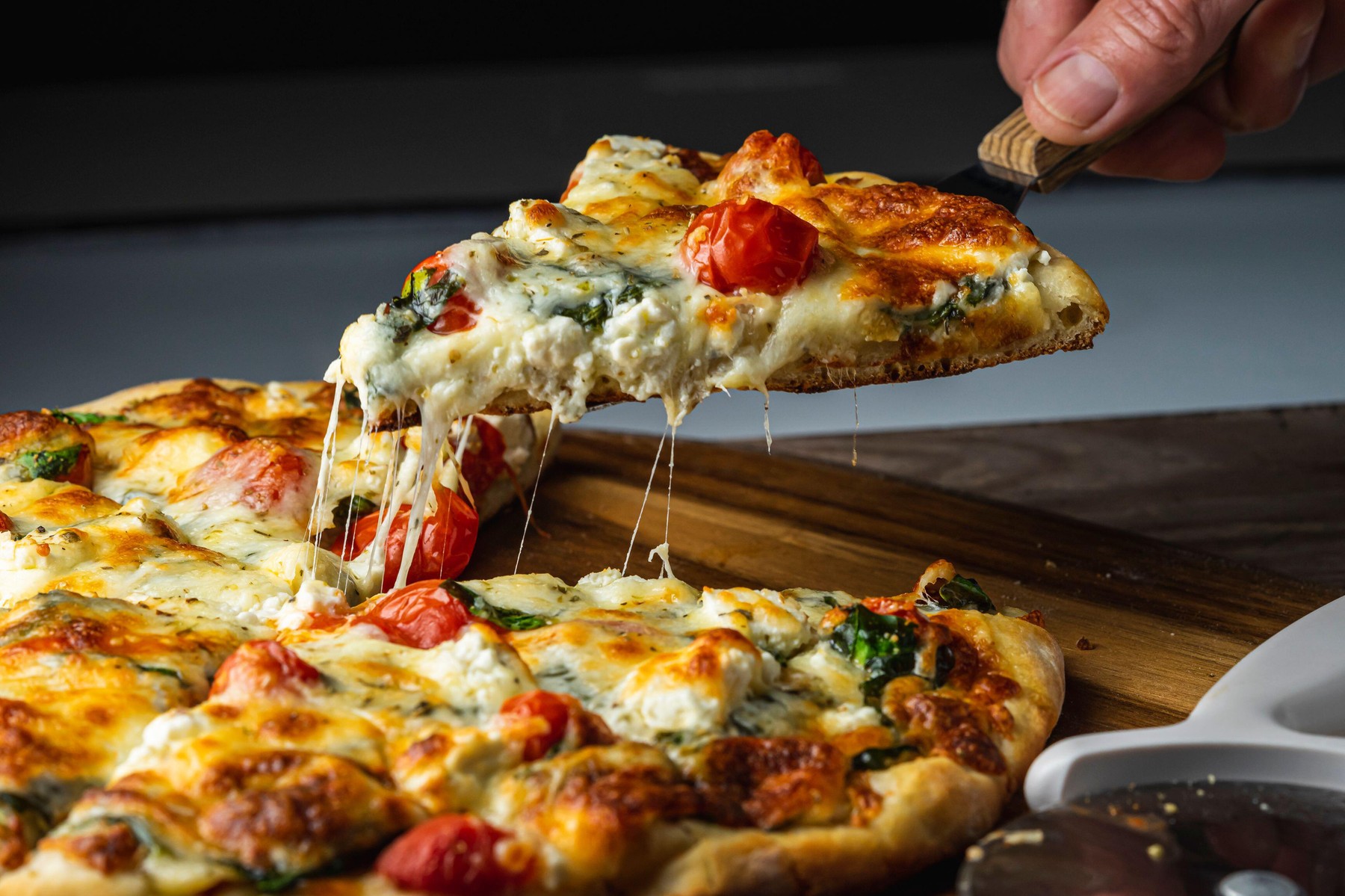 Serving vegetarian pizza