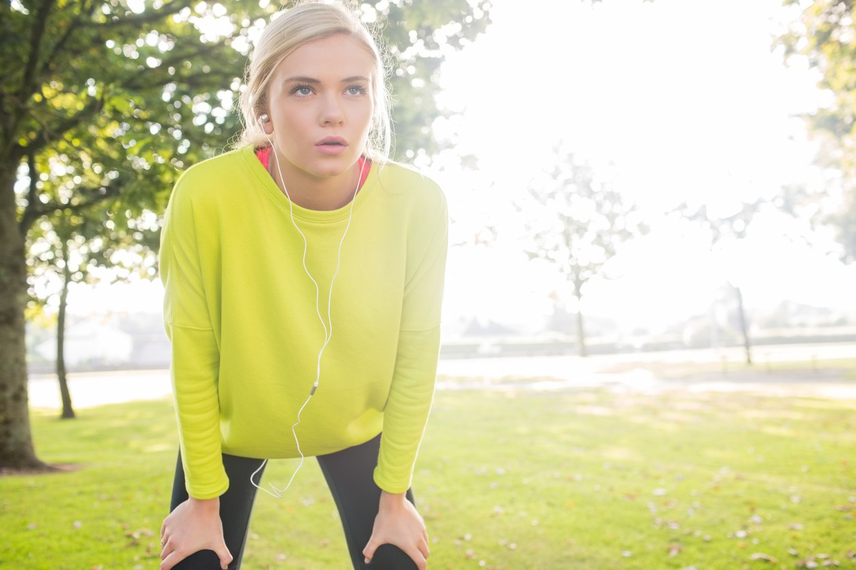 Active tired blonde catching her breath in a park on a sunny day,Image: 176990109, License: Royalty-free, Restrictions: , Model Release: yes, Credit line: - / Wavebreak / Profimedia