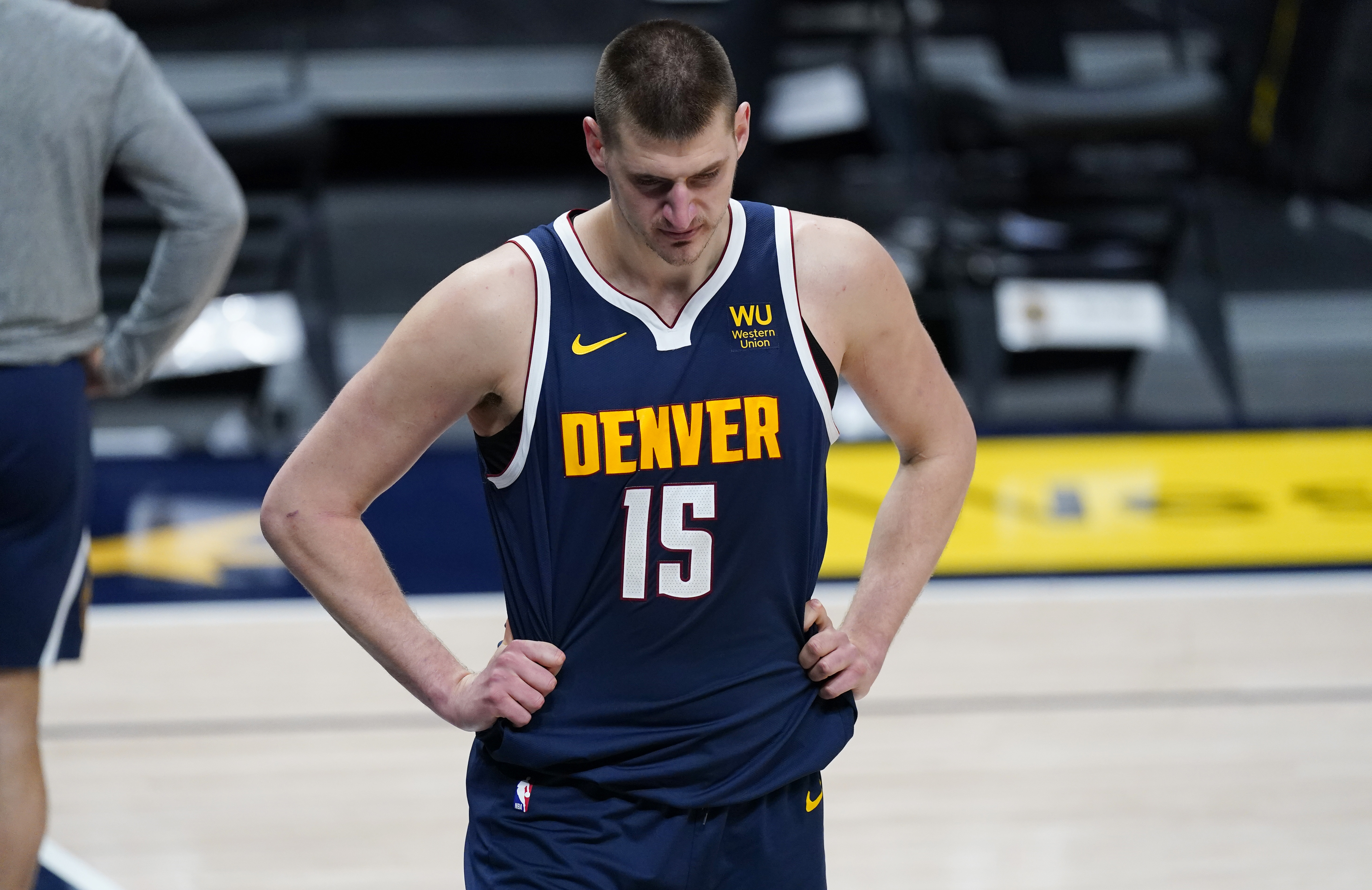 Denver Nuggets center Nikola Jokic reacts as time runs out in the second half of an NBA basketball game against the New Orleans Pelicans Sunday, March 21, 2021, in Denver. The Pelicans won 113-108. (AP Photo/David Zalubowski)