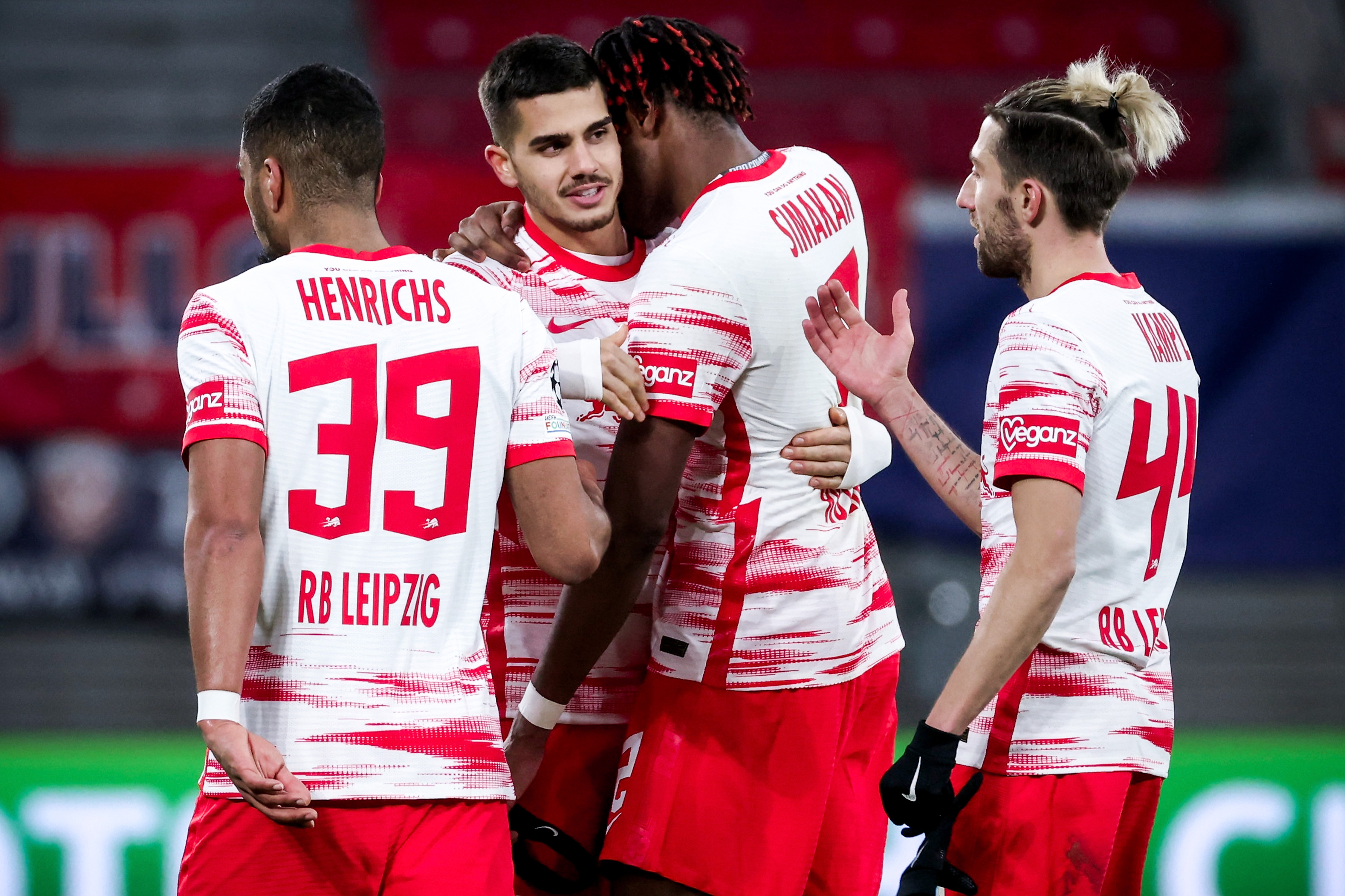 epa09627831 Leipzig players celebrate after winning the UEFA Champions League group A soccer match between RB Leipzig and Manchester City at Red Bull Arena in Leipzig, Germany, 07 December 2021.  EPA-EFE/FILIP SINGER