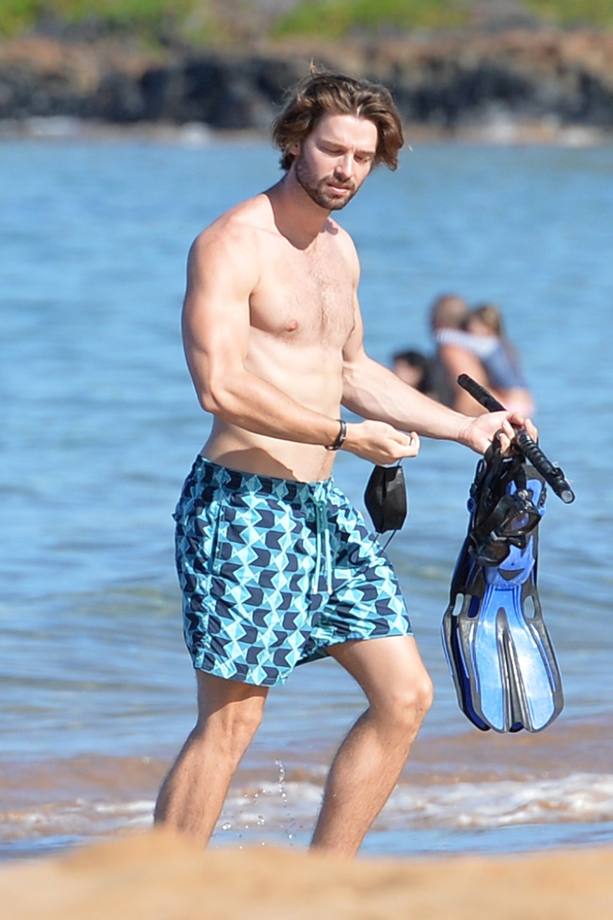 *EXCLUSIVE* Patrick Schwarzenegger shows off his fit abs as he hits the beach in Hawaii