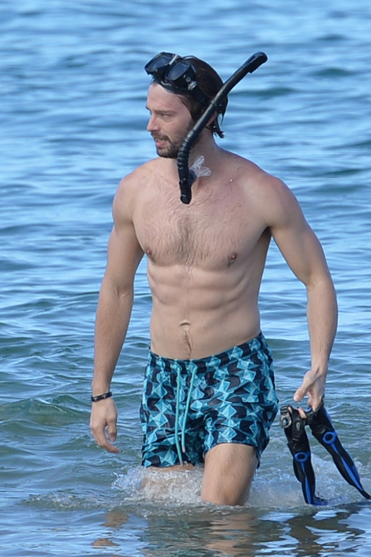 *EXCLUSIVE* Patrick Schwarzenegger shows off his fit abs as he hits the beach in Hawaii