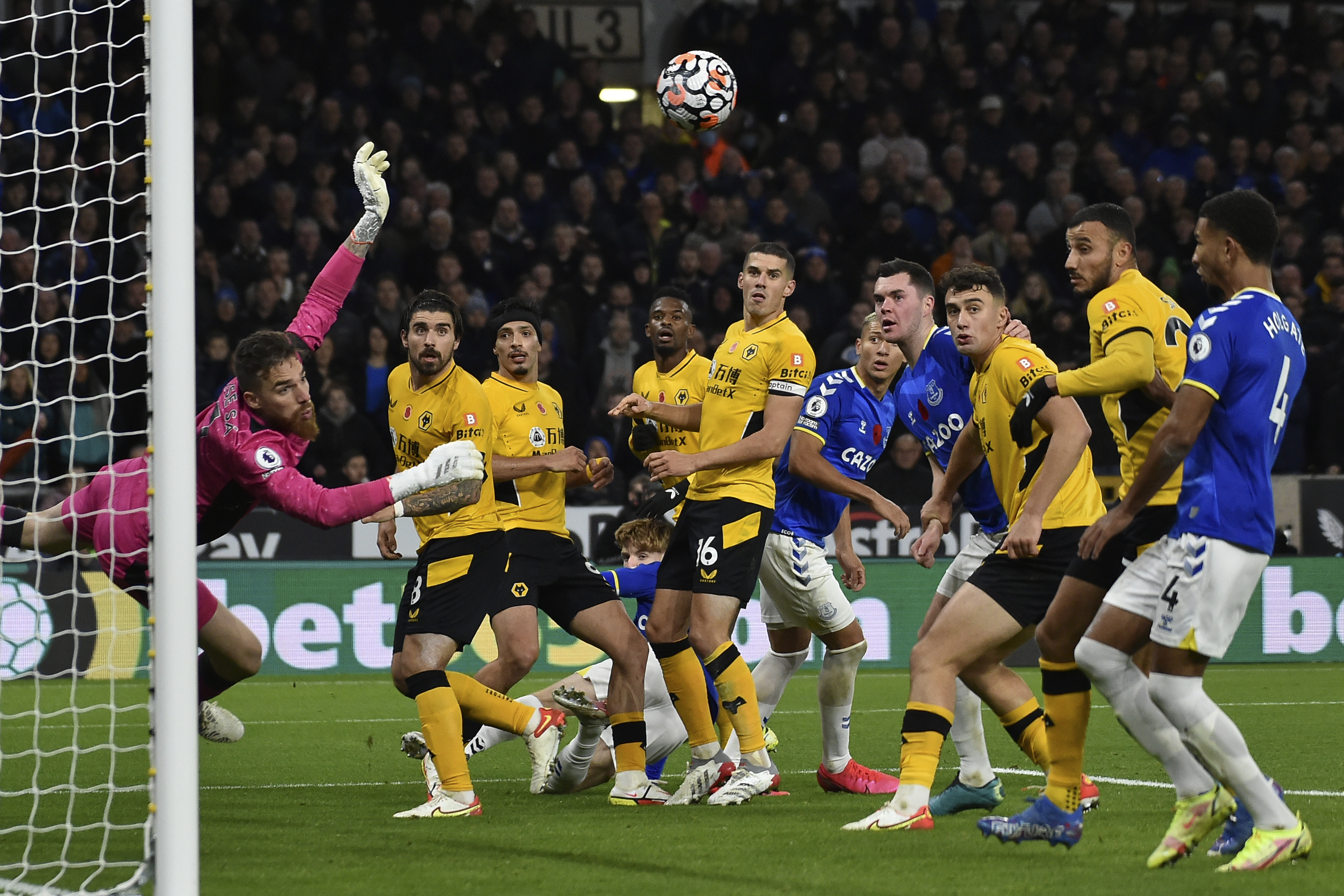 Wolverhampton Wanderers' goalkeeper Jose Sa, left, makes a save during the English Premier League soccer match between Wolverhampton Wanderers and Everton at the Molineux Stadium in Wolverhampton, England, Monday, Nov. 1, 2021. (AP Photo/Rui Vieira)