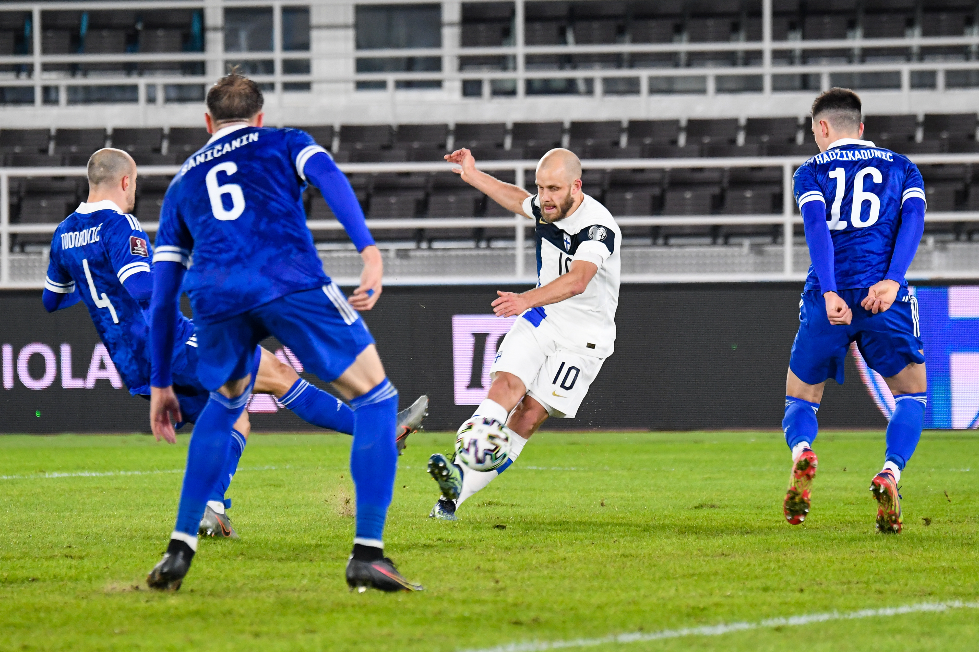 epa09094860 Teemu Pukki of Finland (C) in action during the FIFA World Cup Qatar 2022 European Qualifiers Round one - Group D soccer match between Finland and Bosnia and Herzegovina, in Helsinki, Finland 24 March 2021.  EPA-EFE/KIMMO BRANDT
