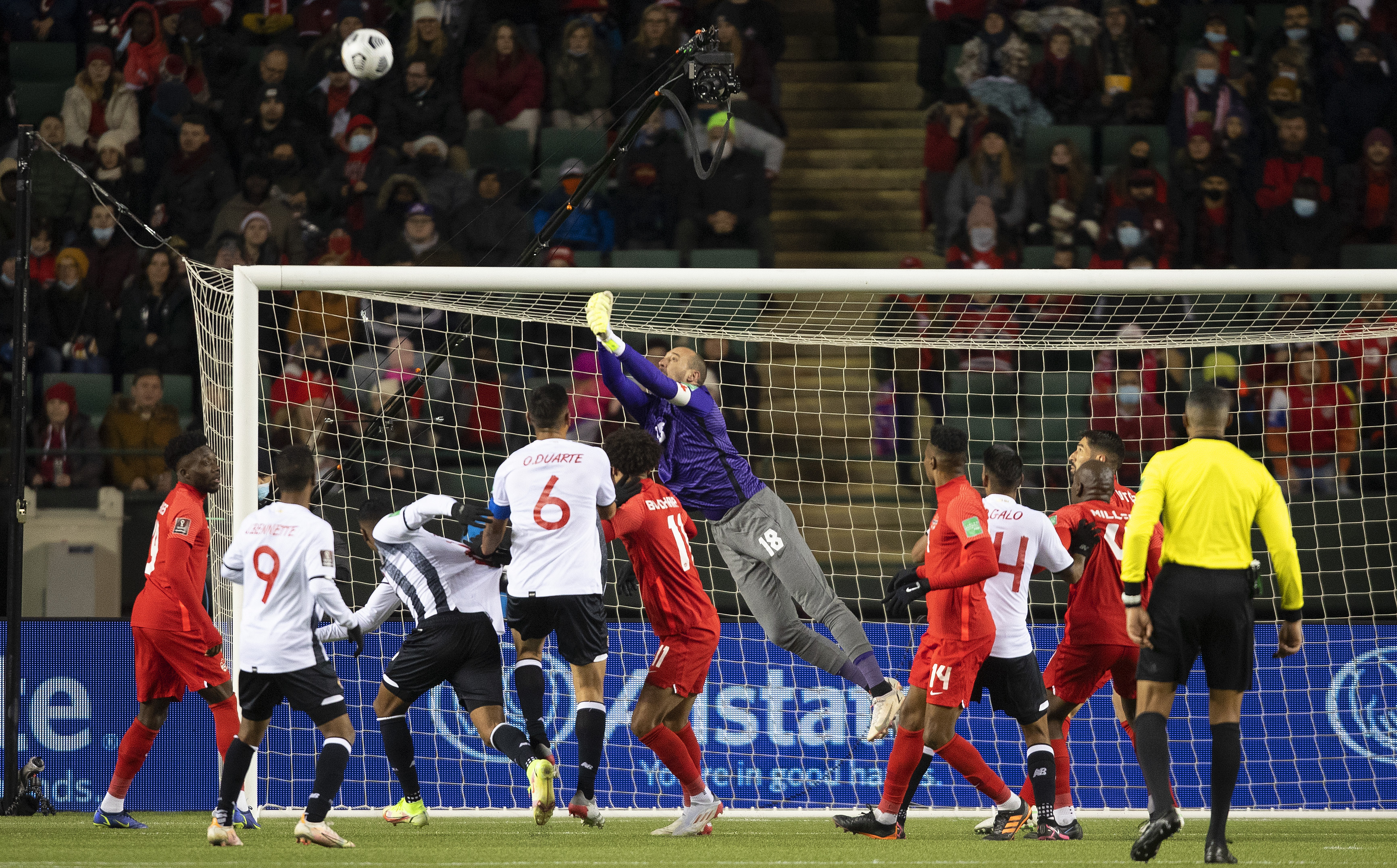 Canada's goalkeeper Milan Borjan (18) makes the save against Costa Rica during first half  of a FIFA World Cup qualifying soccer game in Edmonton, Alberta, Friday, Nov. 12, 2021. (Jason Franson/The Canadian Press via AP)