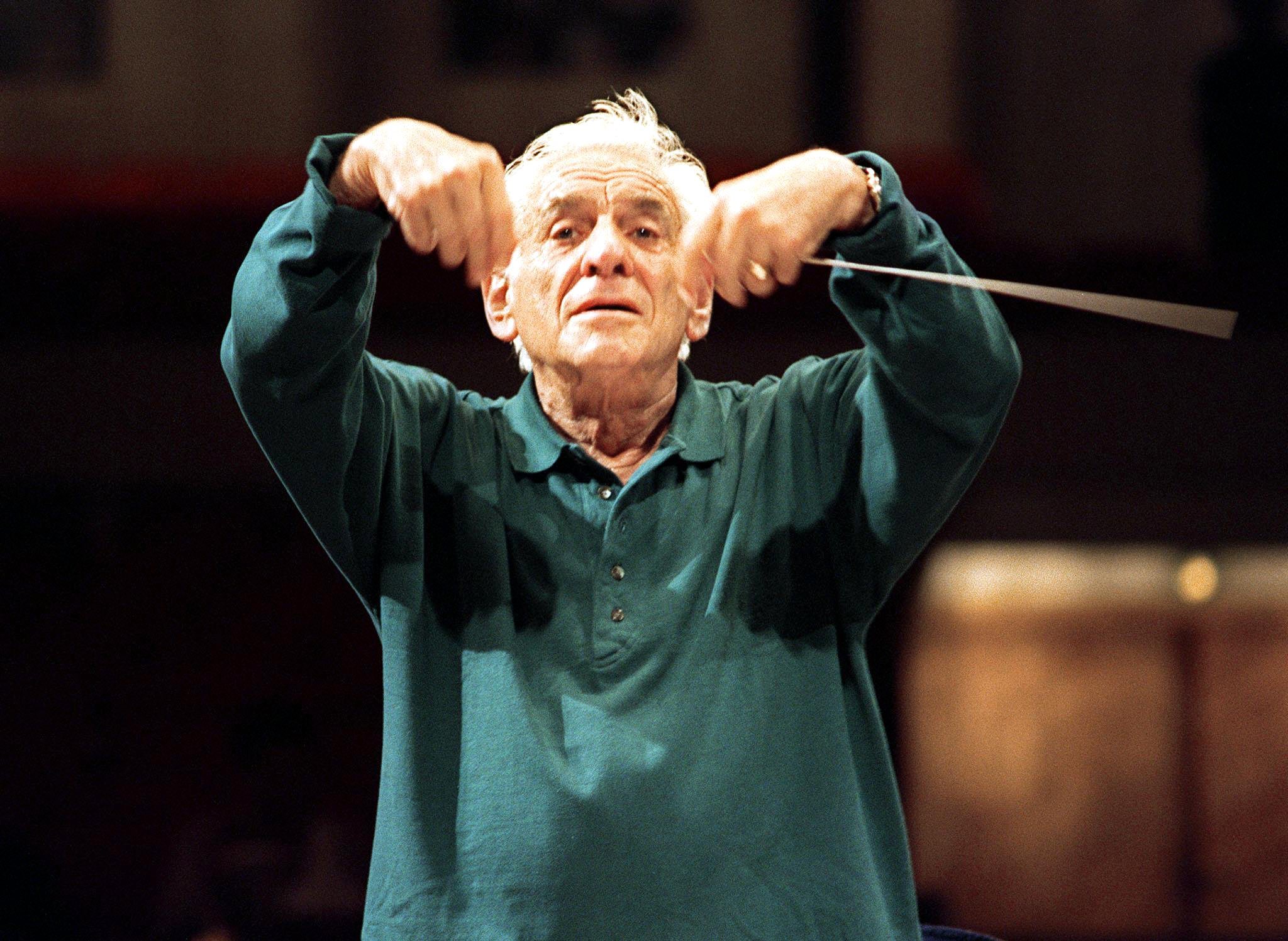 epa06969242 (FILE) - US composer Leonard Bernstein conducts during a rehearsal in Warsaw, Poland, 31 August 1989 (reissued 24 August 2018). Leonard Bernstein would have turned 100 years of age on 25 August 2018.  EPA-EFE/JANEK SKARZYNSKI