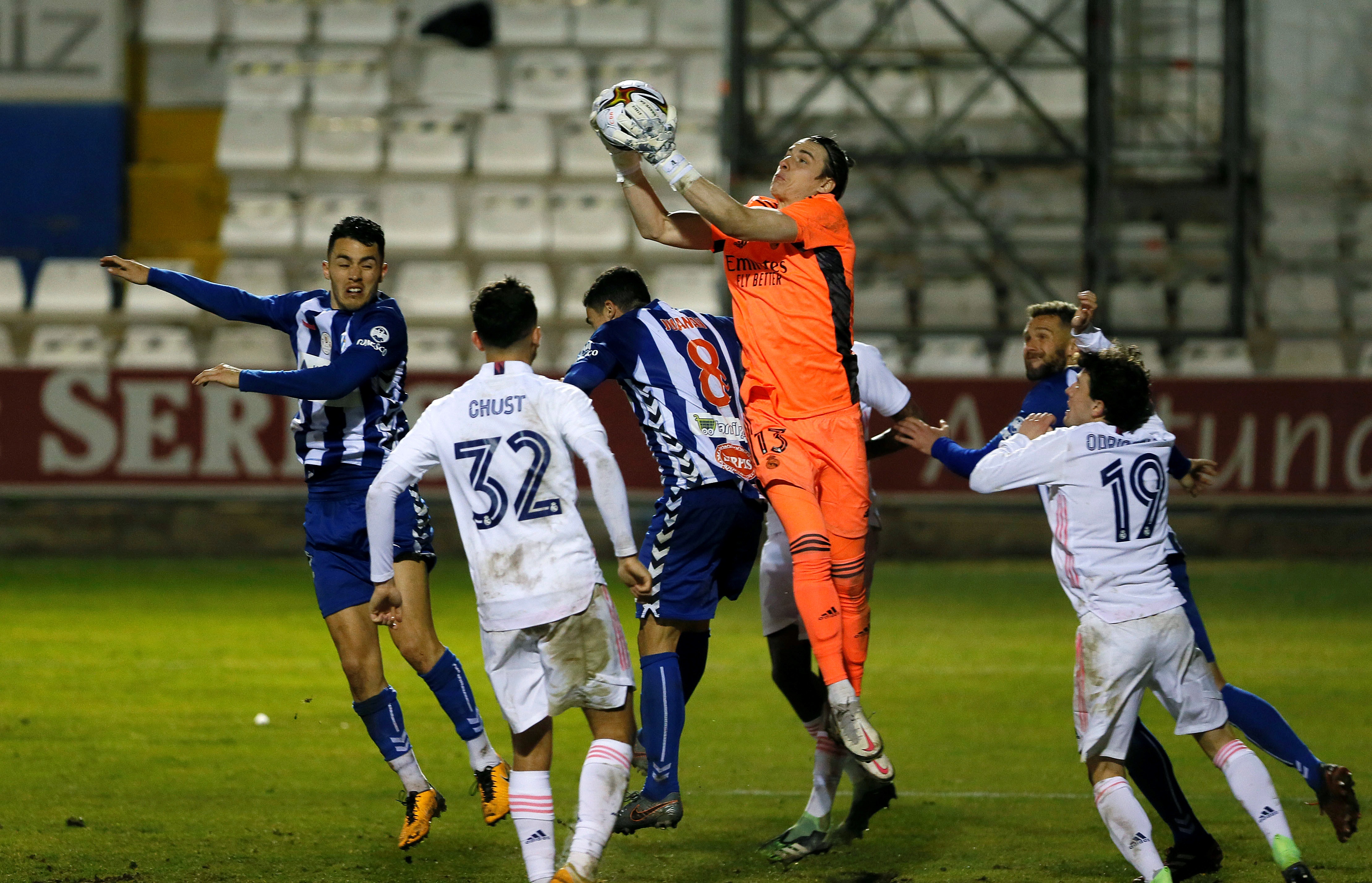 epa08954457 Real Madrid's goalkeeper Andriy Lunin (2-R) saves a ball during the Spain's King Cup round of 32 match between Alcoyano and Real Madrid at El Collao stadium in Alcoy, Alicante, eastern Spain, 20 January 2021.  EPA-EFE/Manuel Lorenzo