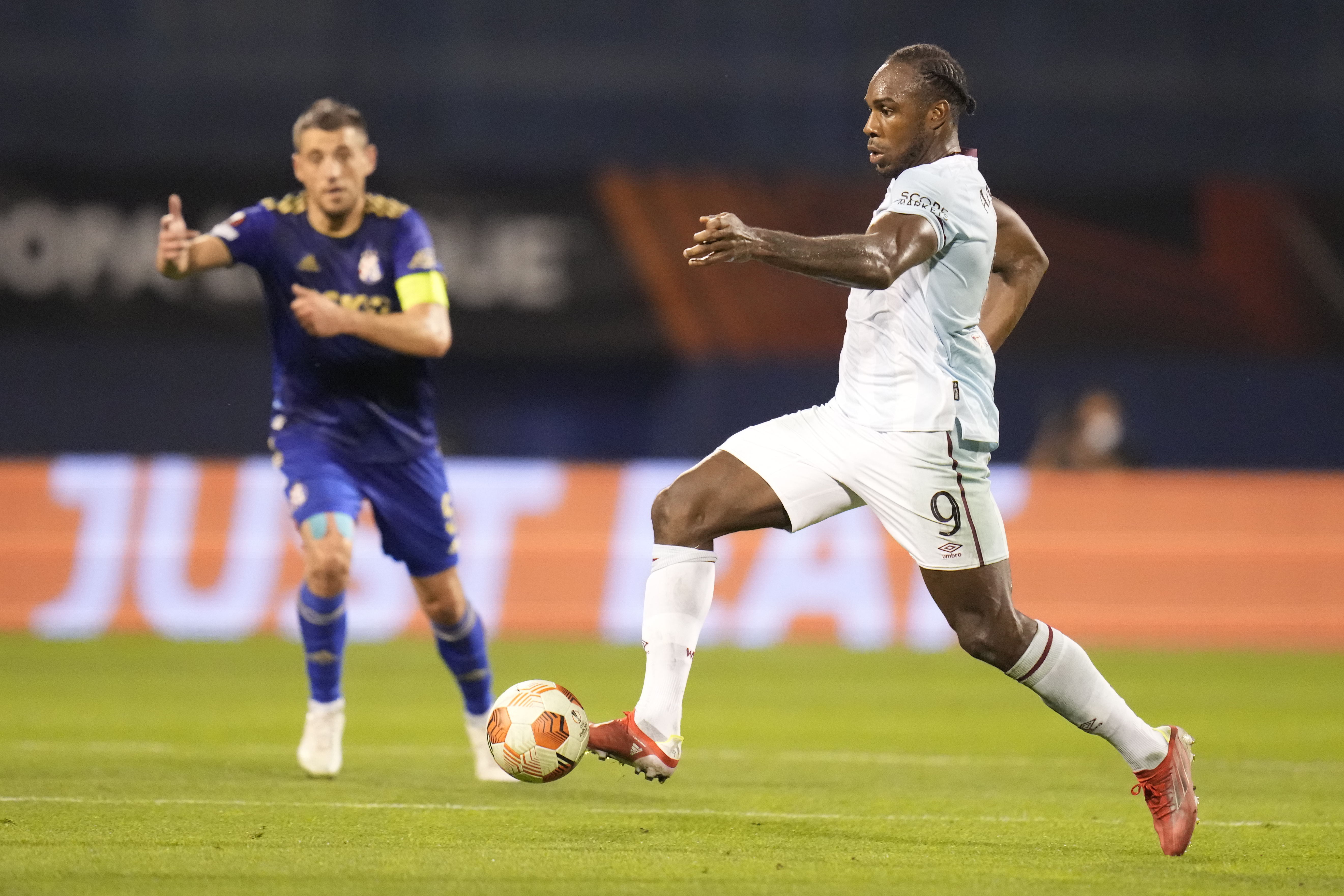 West Ham's Michail Antonio, right, is in action during the Group H Europa League soccer match between Dinamo Zagreb and West Ham at the Maksimir stadium in Zagreb, Thursday, Sept. 16, 2021. (AP Photo/Darko Bandic)