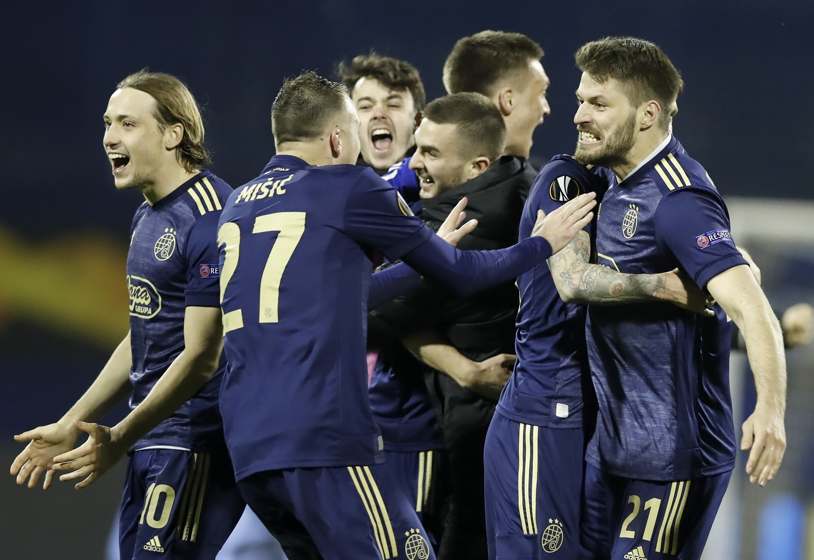 epa09082918 Players of Zagreb celebrate winning the UEFA Europa League Round of 16, second leg match between Dinamo Zagreb and Tottenham Hotspur in Zagreb, Croatia, 18 March 2021.  EPA-EFE/ANTONIO BAT