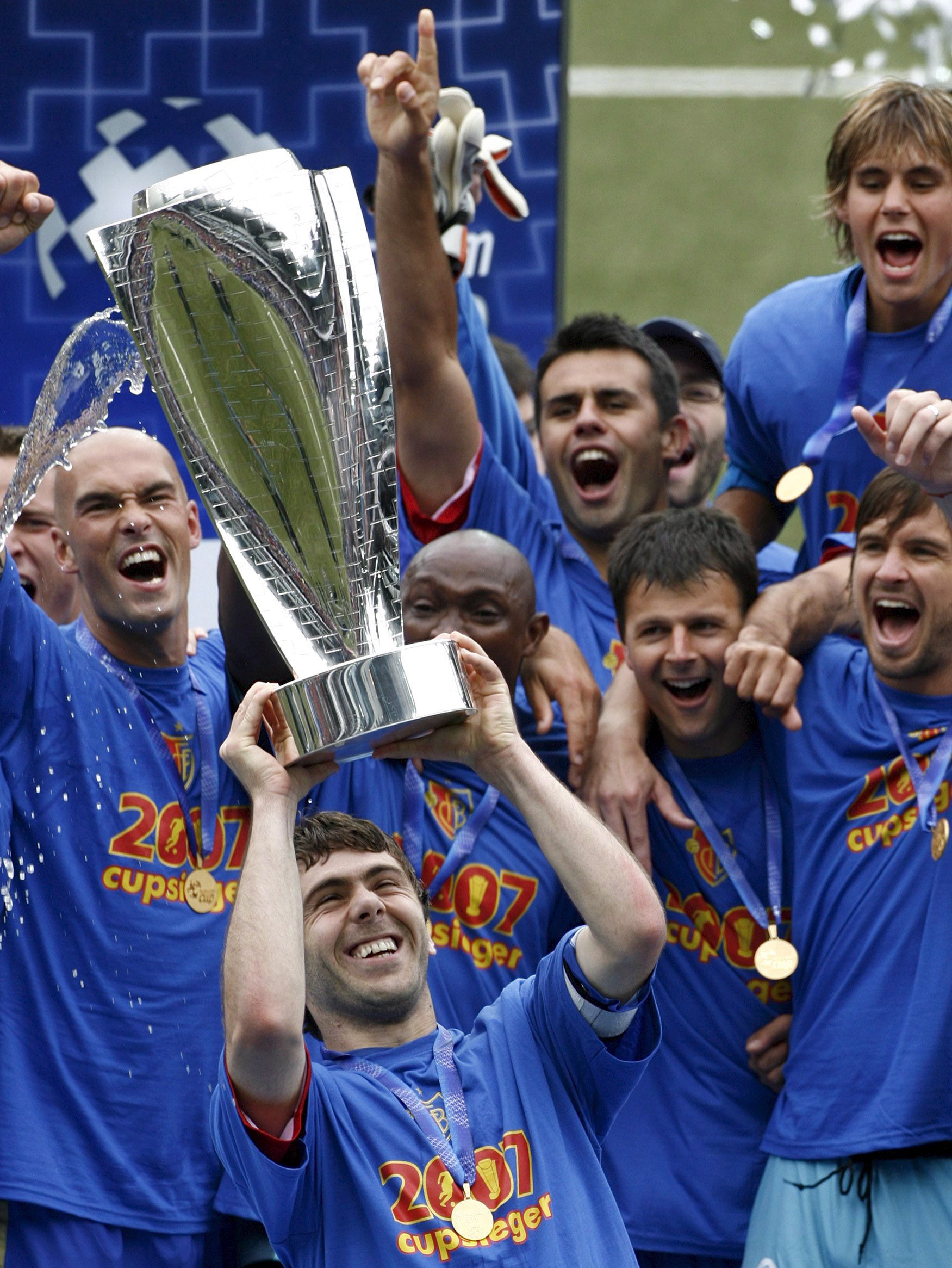 epa01022127 FC Basel's captain Ivan Ergic holds the trophy celebrating FC Basel's victory in the Swiss soccer cup final against FC Lucerne in Bern, Switzerland, 28 May, 2007.  EPA/ALESSANDRO DELLA VALLE