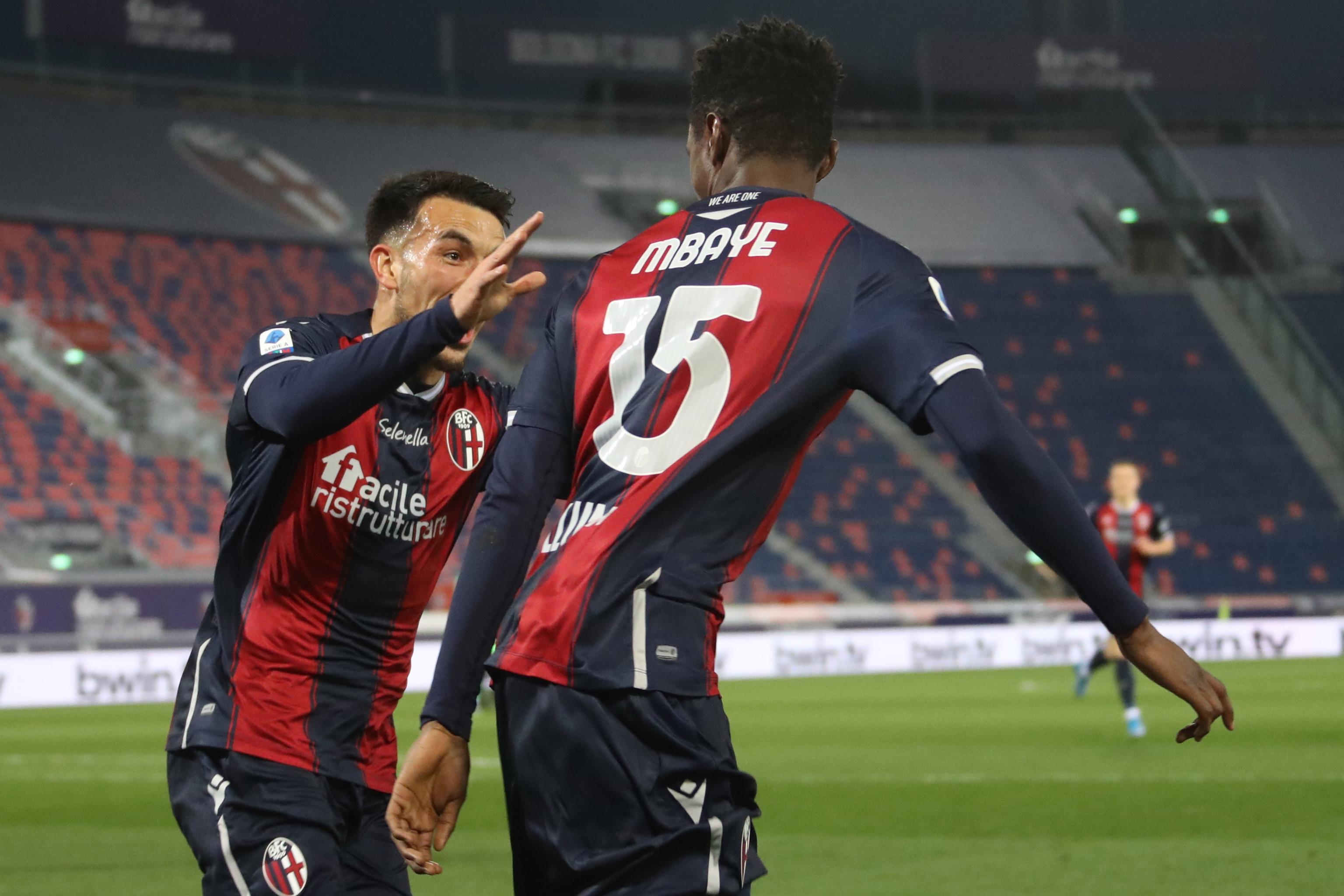 epa09041048 Bologna's Ibrahima Mbaye (R) celebrates scoring the 1-0 goal during the Italian Serie A soccer match Bologna Fc vs. S.S. Lazio at the Renato Dall'Ara stadium in Bologna, Italy, 27 February 2021.  EPA-EFE/GIORGIO BENVENUTI