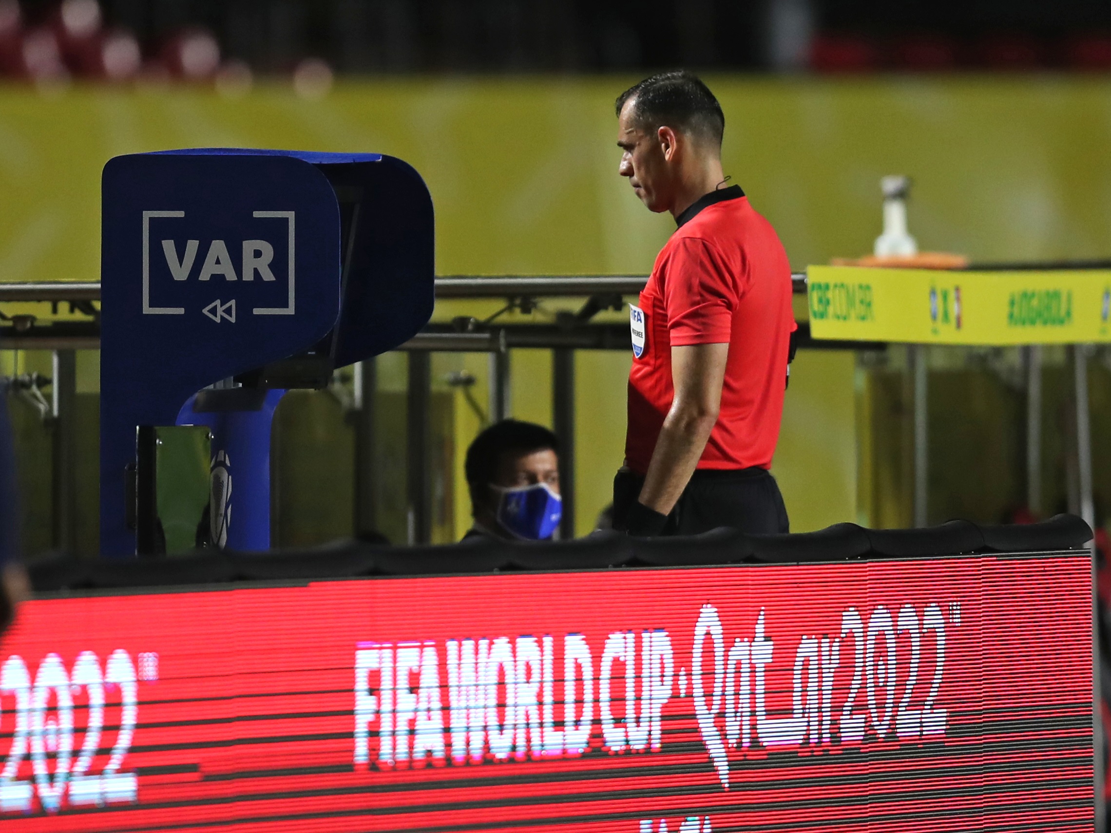 epa08819208 Match referee Juan Gabriel Benitez reviews the VAR during the Qatar 2022 World Cup Qualifiers soccer match between Brazil and Venezuela, at the Morumbi Stadium, in Sao Paulo, Brazil, 13 November 2020.  EPA-EFE/Fernando Bizerra Jr POOL