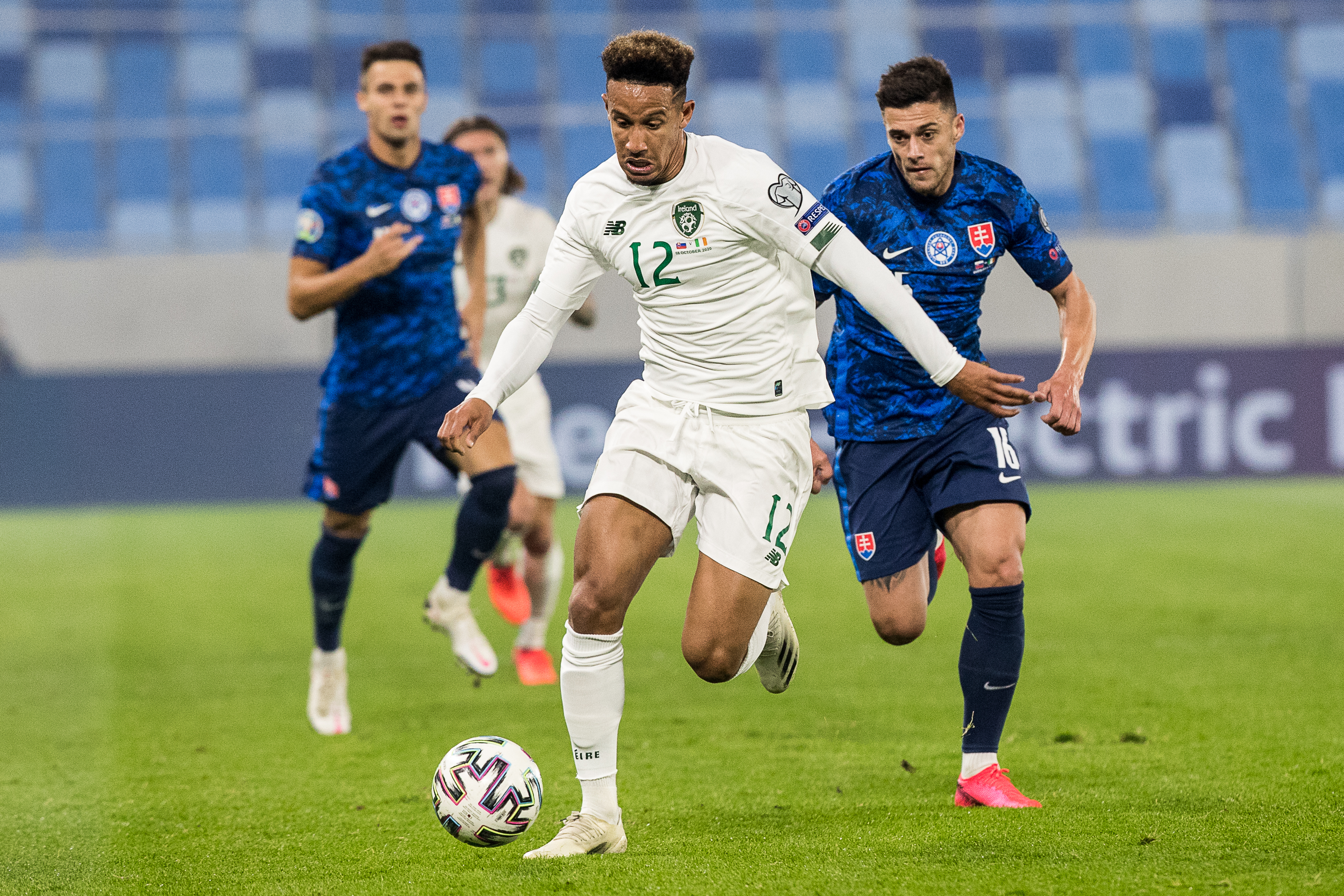 epa08730267 Robert Mazan of Slovakia (R) and Callum Robinson of Ireland (C) in action during the UEFA Euro qualifying playoff semifinals soccer match between Slovakia and Ireland in Bratislava, Slovakia, 08 October 2020.  EPA-EFE/JAKUB GAVLAK