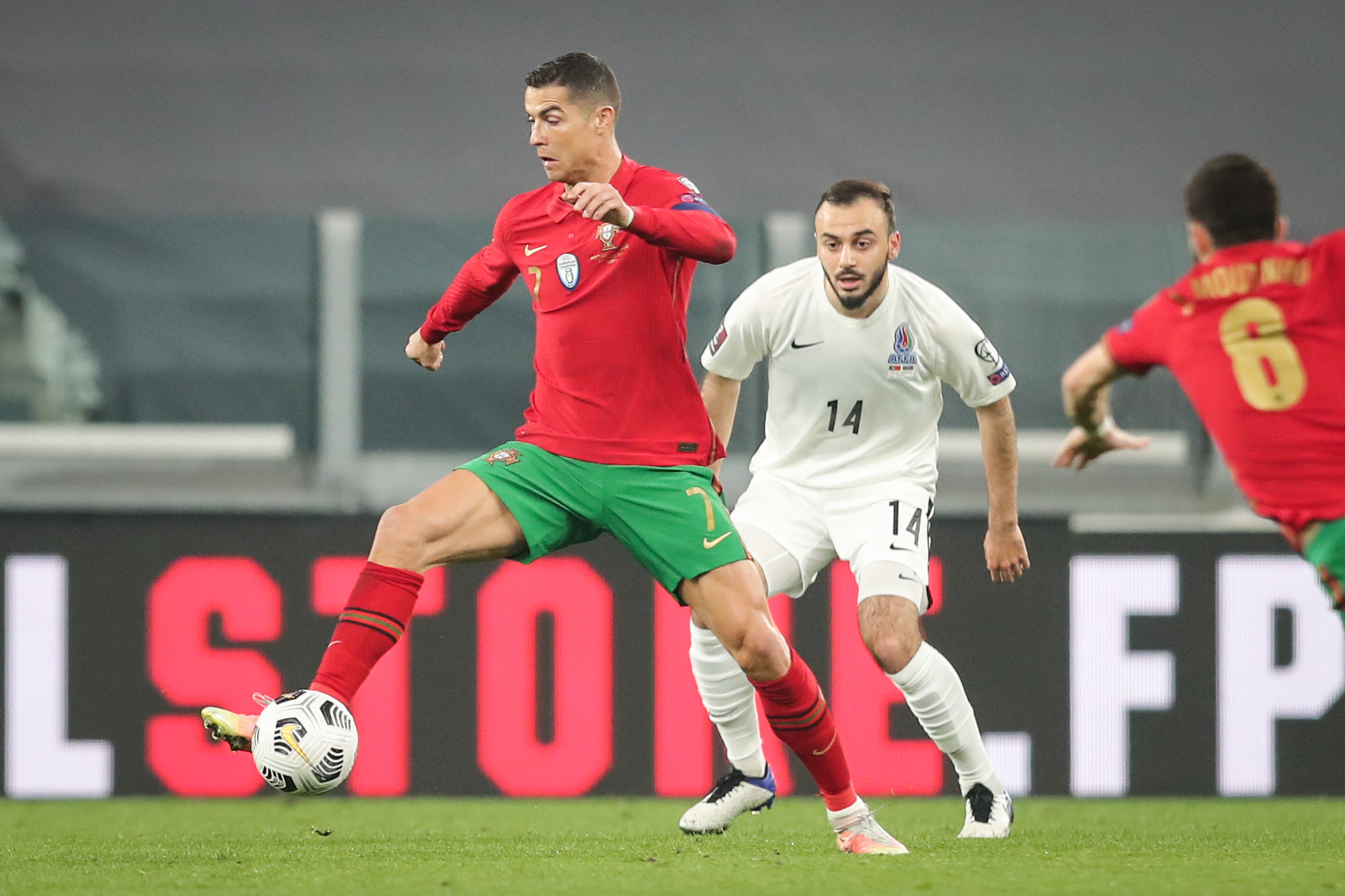 epa09094722 Portugal's Cristiano Ronaldo (L) fights for the ball with Azerbaijan's Elvin Badalov during the FIFA World Cup Qatar 2022 Group A qualifier match Portugal against Azerbaijan in Turin, Italy, 24 March 2021.  EPA-EFE/MIGUEL A. LOPES