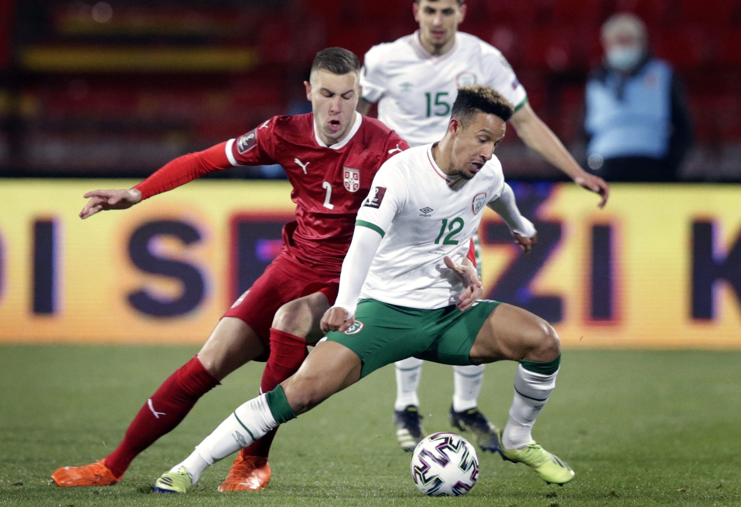 epa09094640 Ireland?s Callum Robinson (R) is tackled by Serbia?s Strahinja Pavlovic (L) during the FIFA World Cup 2022 qualification match between Serbia and Ireland in Belgrade, Serbia, 24 March 2021.  EPA-EFE/ANDREJ CUKIC