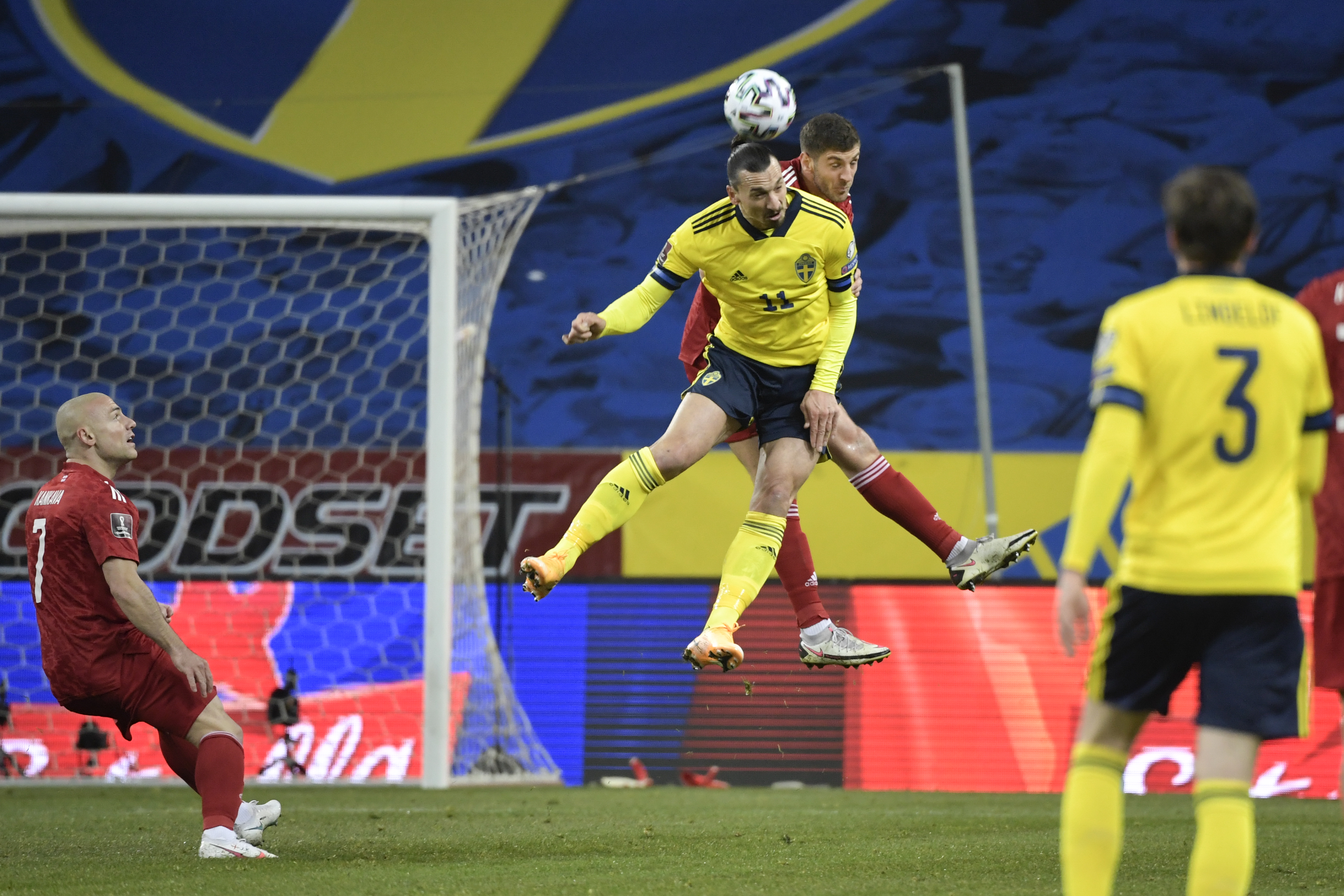 epa09097574 Sweden's Zlatan Ibrahimovic (C-L) vies with Georgia's Lasha Dvali during the FIFA World Cup 2022 qualifier soccer match between Sweden and Georgia at Friends Arena in Stockholm, Sweden, 25 March 2021  EPA-EFE/Pontus Lundahl  SWEDEN OUT