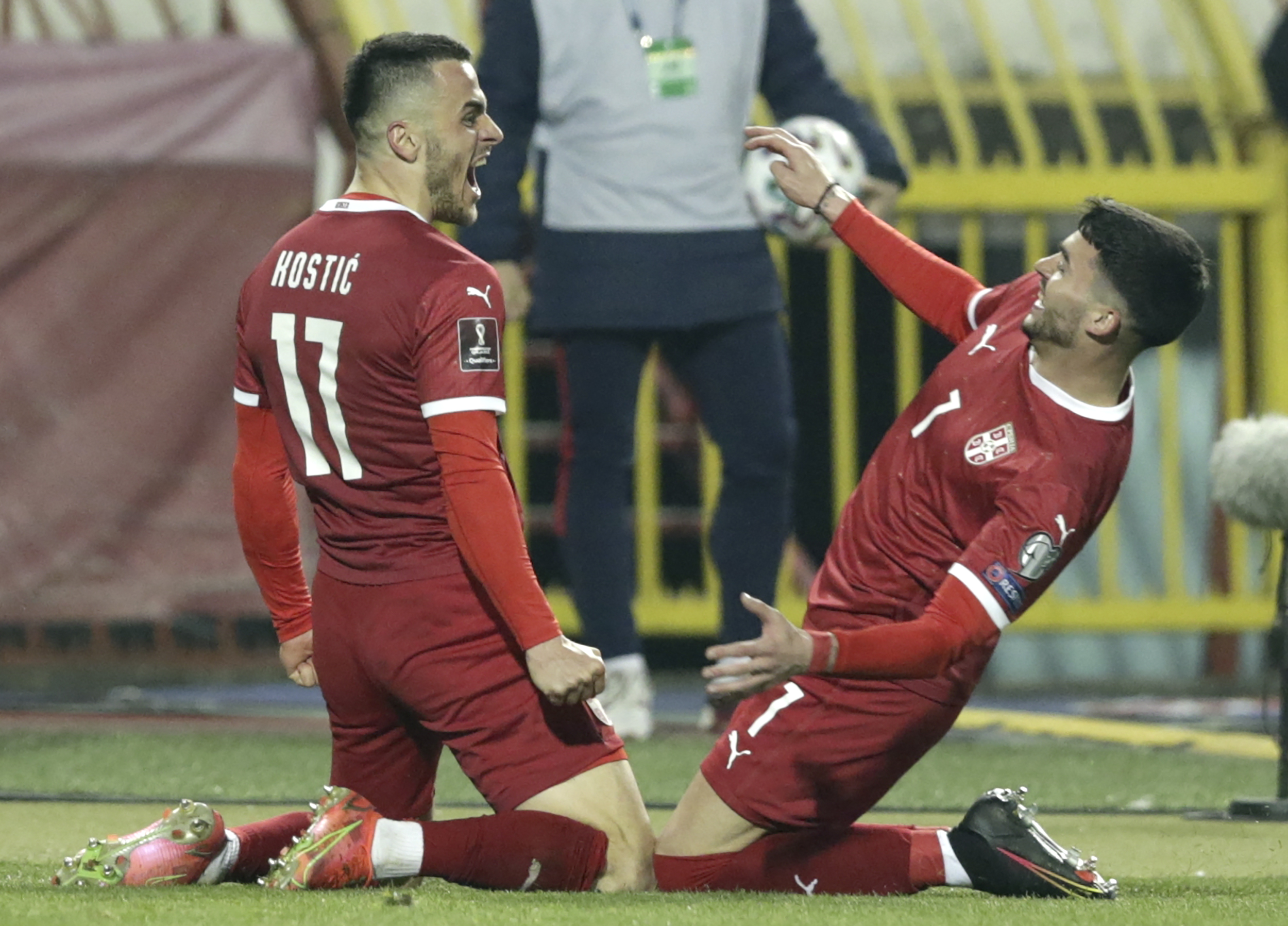 epa09102156 Serbia?s Filip Kostic (L) celebrates after scoring the 2-2 equalizer during the FIFA World Cup 2022 qualifying soccer match between Serbia and Portugal in Belgrade, Serbia, 27 March 2021.  EPA-EFE/Andrej Cukic