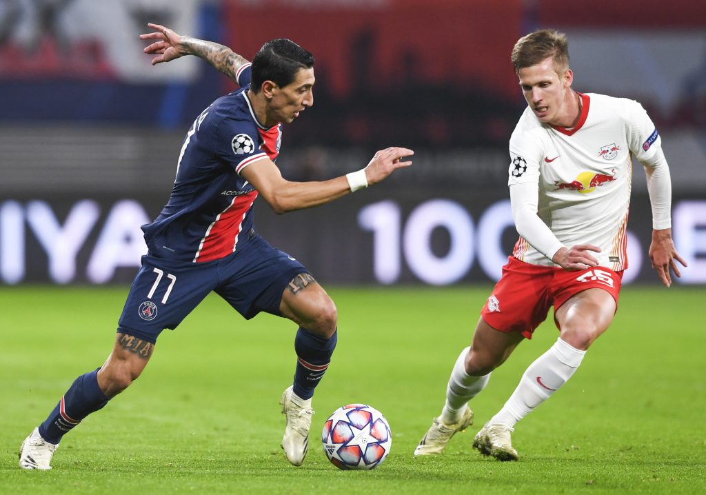 epa08799145 Angel Di Maria (L) of PSG in action against Dani Olmo (R) of Leipzig during the UEFA Champions League group H soccer match between RB Leipzig and Paris Saint-Germain (PSG) in Leipzig, Germany, 04 November 2020.  EPA-EFE/Filip Singer