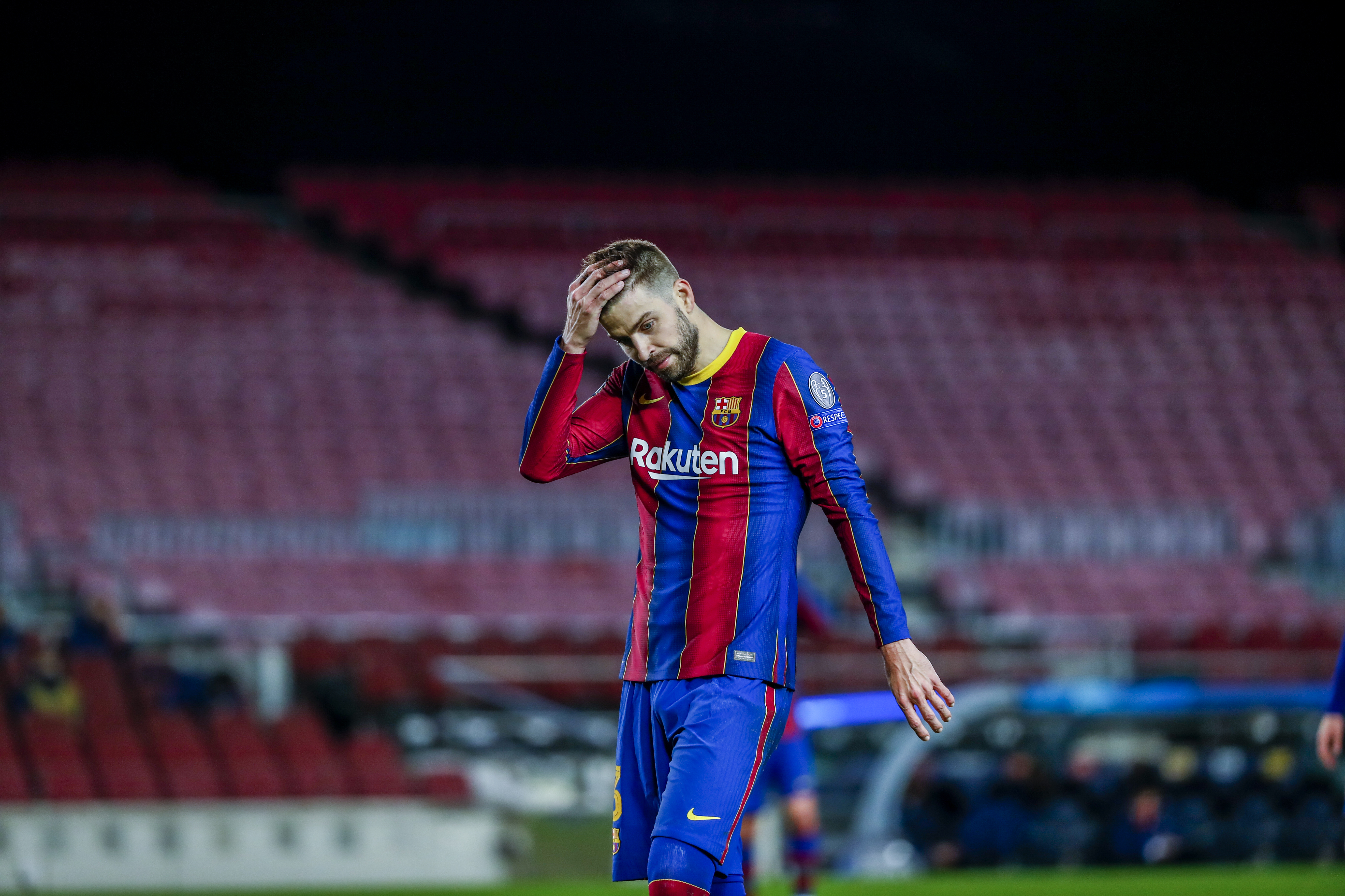 Barcelona's Gerard Pique reacts during the Champions League round of 16, first leg soccer match between FC Barcelona and Paris Saint-Germain at the Camp Nou stadium in Barcelona, Spain, Tuesday, Feb. 16, 2021. (AP Photo/Joan Monfort)