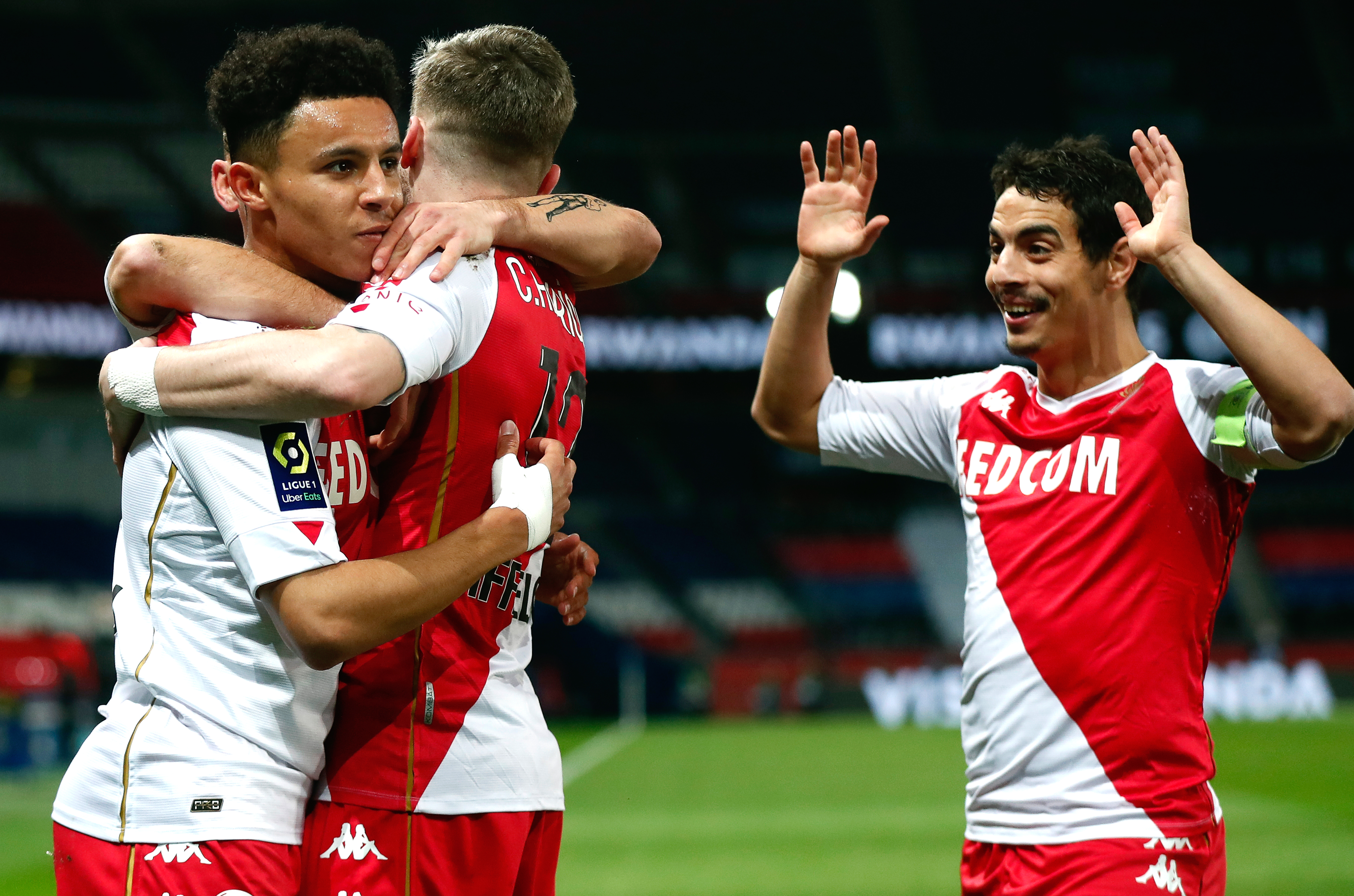 epa09028799 Sofiane Diop (L) of Monaco celebrates with teammates after scoring the opening goal during the French Ligue 1 soccer match between Paris Saint-Germain (PSG) and AS Monaco in Paris, France, 21 February 2021.  EPA-EFE/IAN LANGSDON