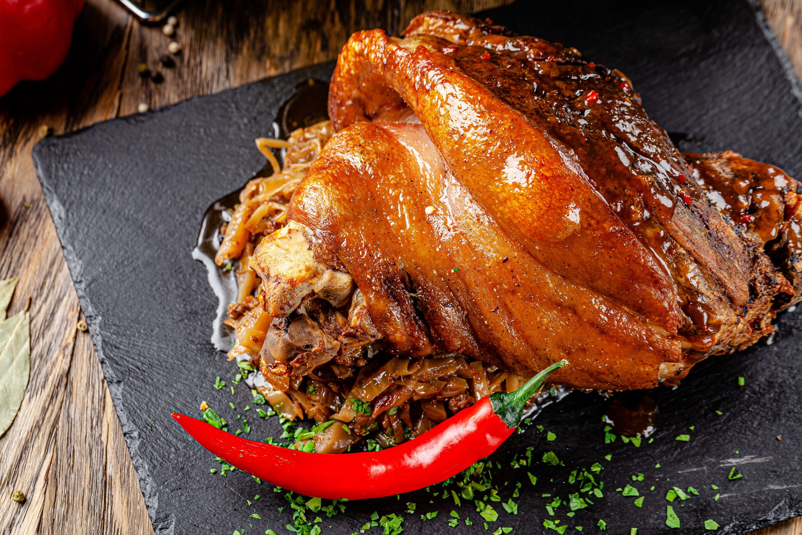 30.10. (b) Svinjska butkica stock-photo-pork-knuckle-baked-on-a-baking-sheet-in-the-oven-with-onions-carrots-and-spices-delicious-1940741596