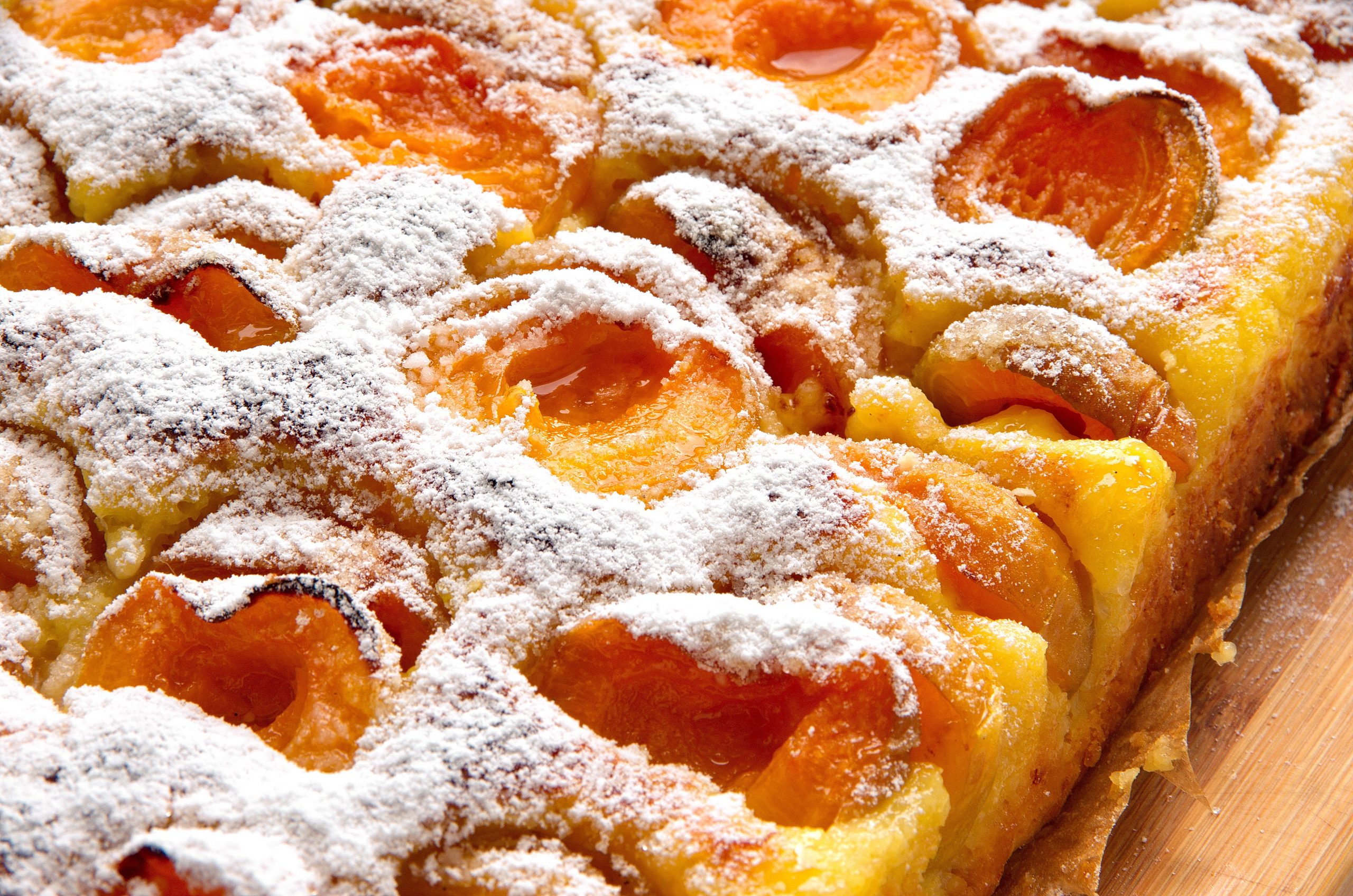 21.7.21. (b) Slatkis sa kajsijama stock-photo-close-up-of-a-surface-of-homemade-apricot-cake-on-wooden-table-delicious-fresh-rustic-apricot-cake-1137219701