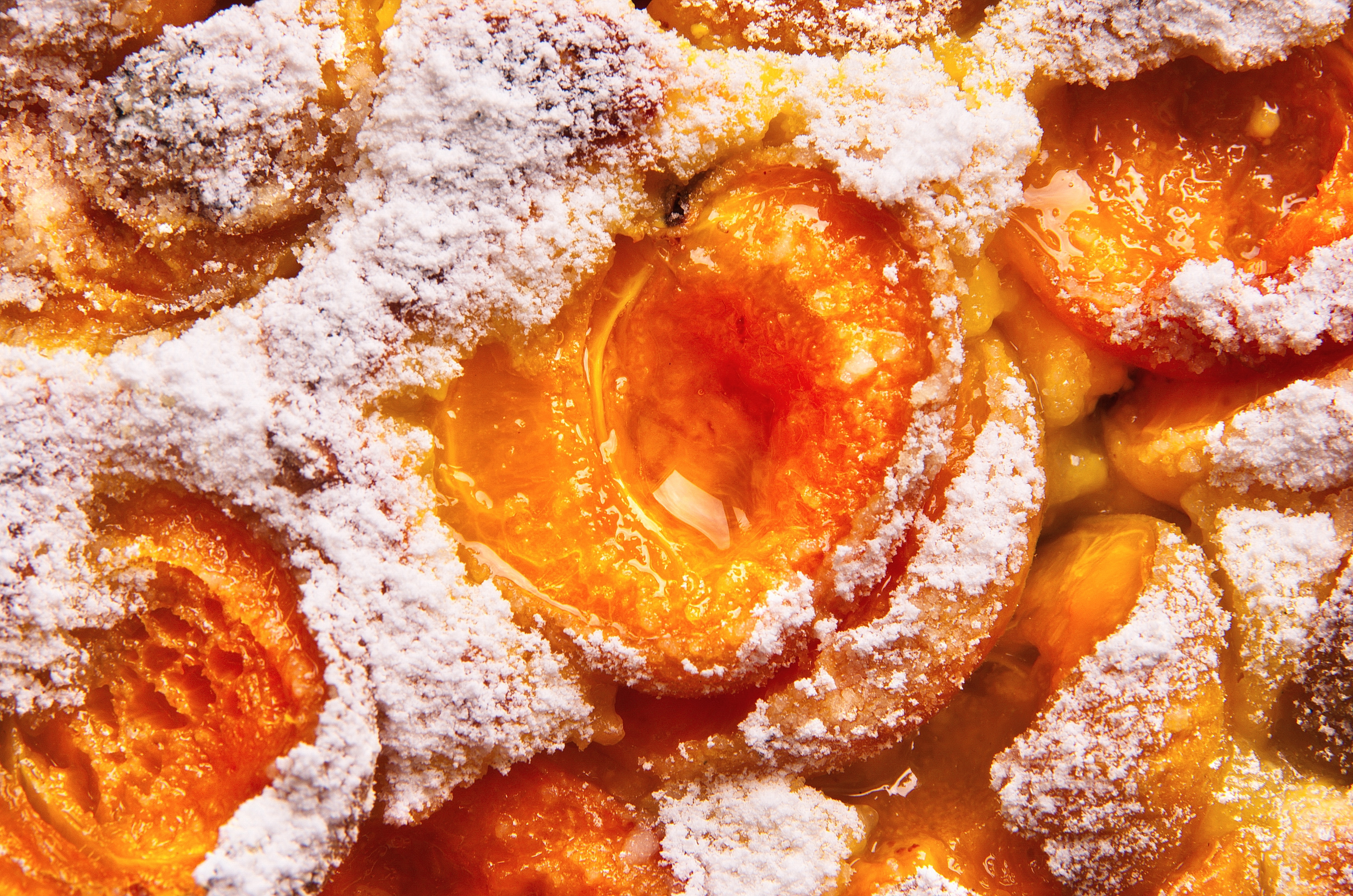 21.7.21. (a) Slatkis sa kajsijama stock-photo-close-up-of-a-surface-of-homemade-apricot-cake-delicious-fresh-rustic-apricot-cake-sprinkled-with-1137219698