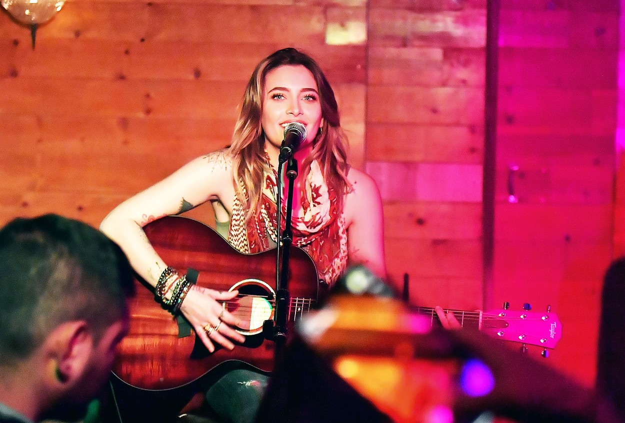 Paris Jackson and boyfriend Gabriel Glenn do a little performance with their band 'The SoundFlowers' at 'Davey Waynes' In Hollywood, CA.