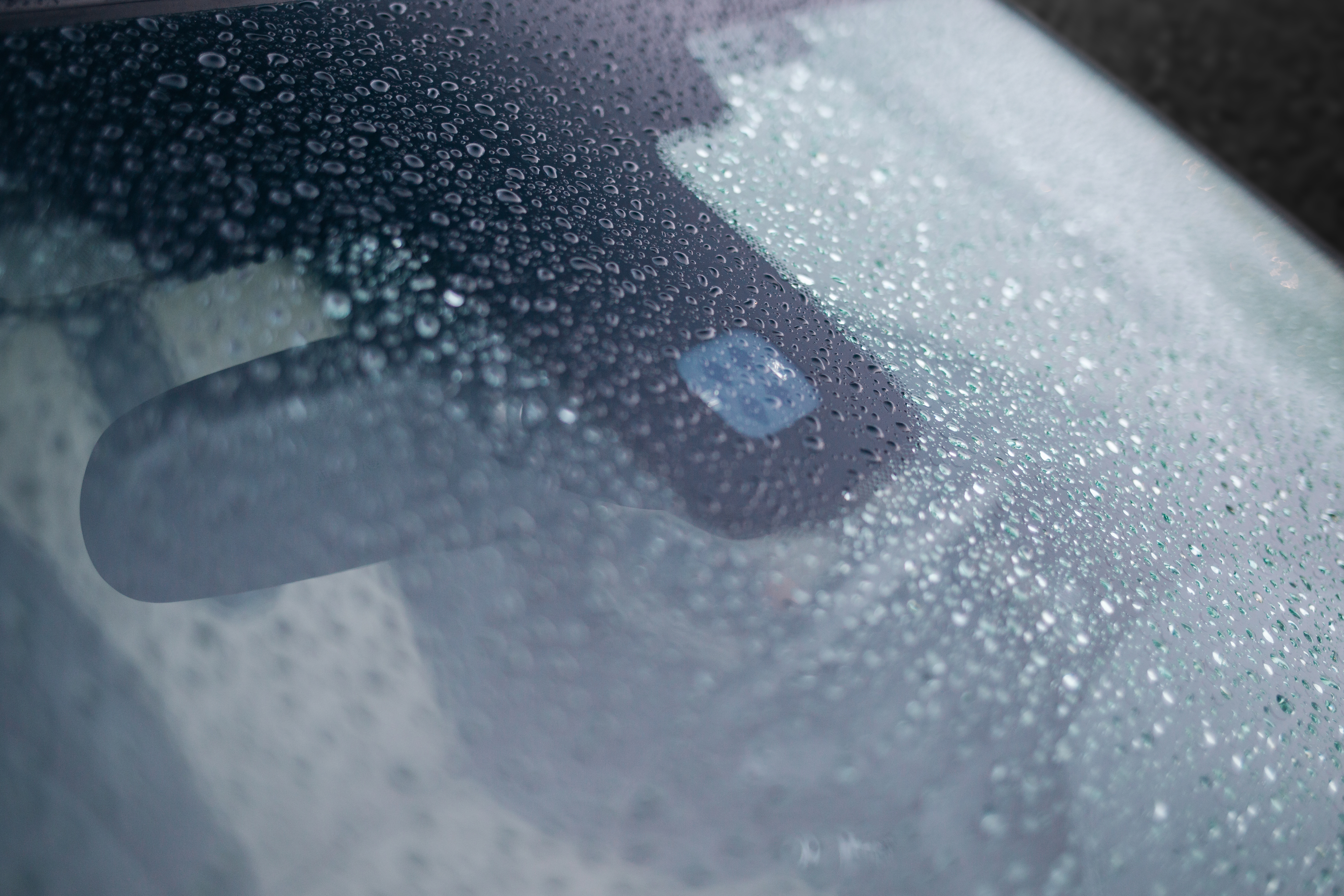 Rain,And,Light,Sensor,On,The,Windshield,Of,The,Car