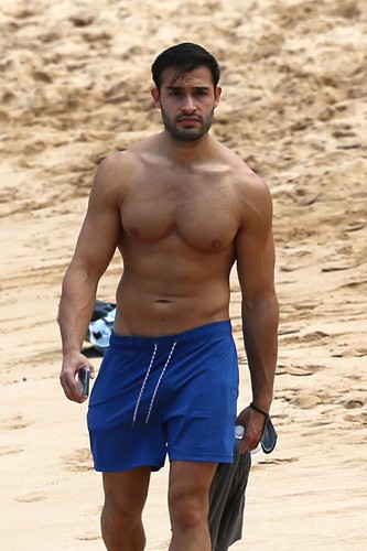 EXCLUSIVE: Britney Spear's boyfriend Sam Asghari takes a solo stroll on the beach while on vacation in Maui