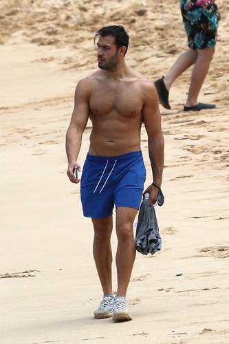 EXCLUSIVE: Britney Spear's boyfriend Sam Asghari takes a solo stroll on the beach while on vacation in Maui