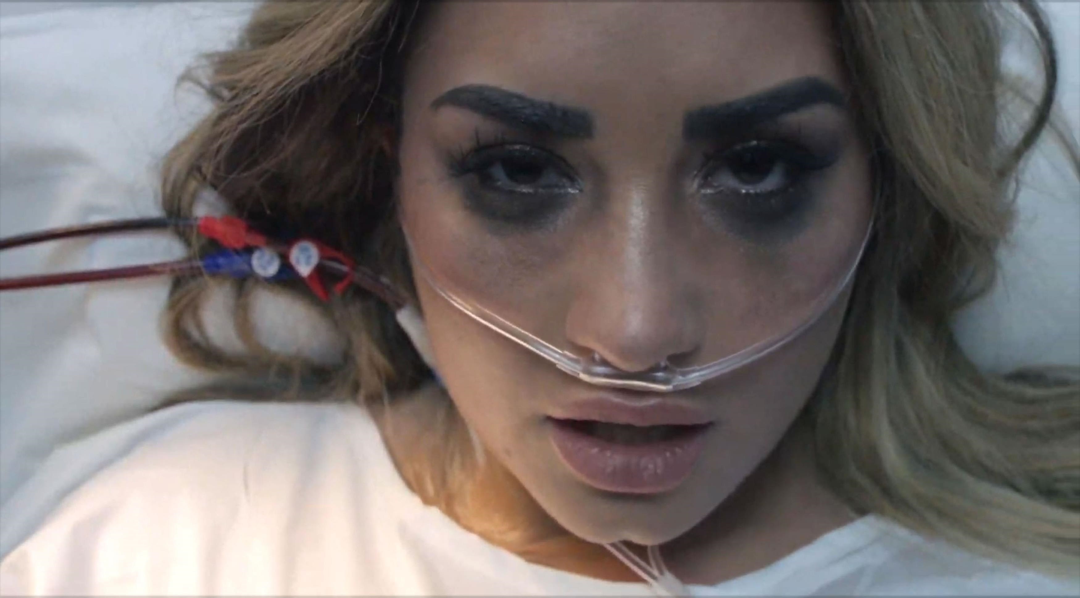 Demi Lovato recreates her overdose in Dancing With the Devil video