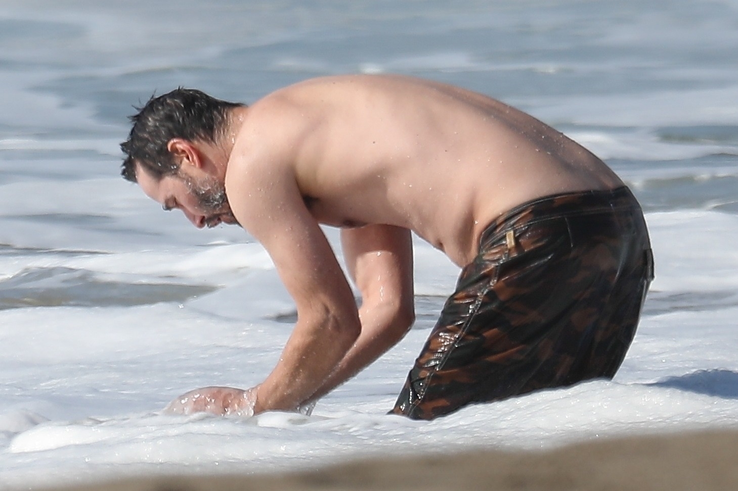 *EXCLUSIVE* Keanu Reeves shows off his very fit bod at 56 as he goes for a swim in Malibu **WEB EMBARGO UNTIL 12:15 PST on January 6, 2021**
