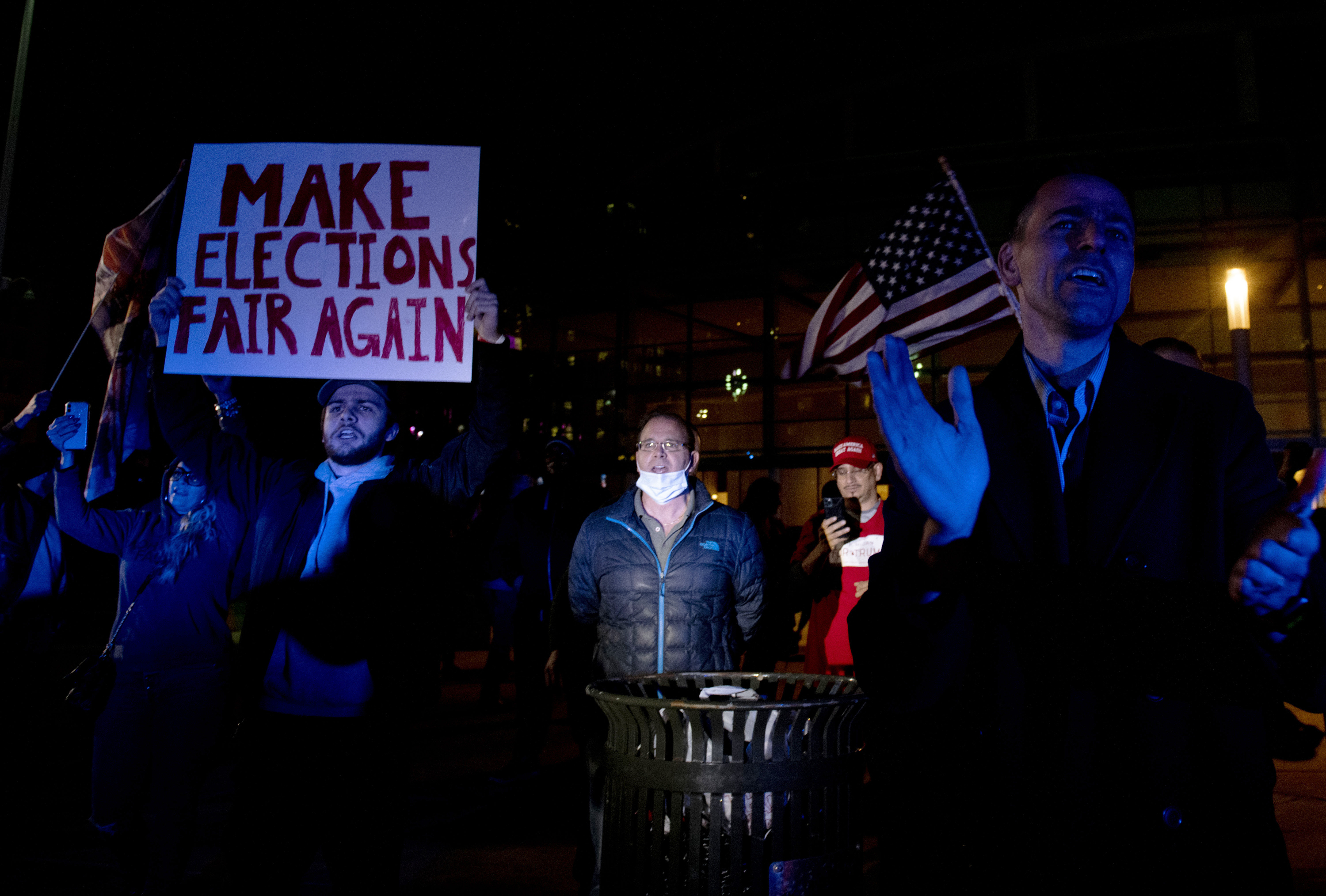 Supporters of U.S. President Donald Trump protest outside the Central Counting Board hall Thursday, Nov. 5, 2020, in Detroit. (Nicole Hester/Ann Arbor News via AP)