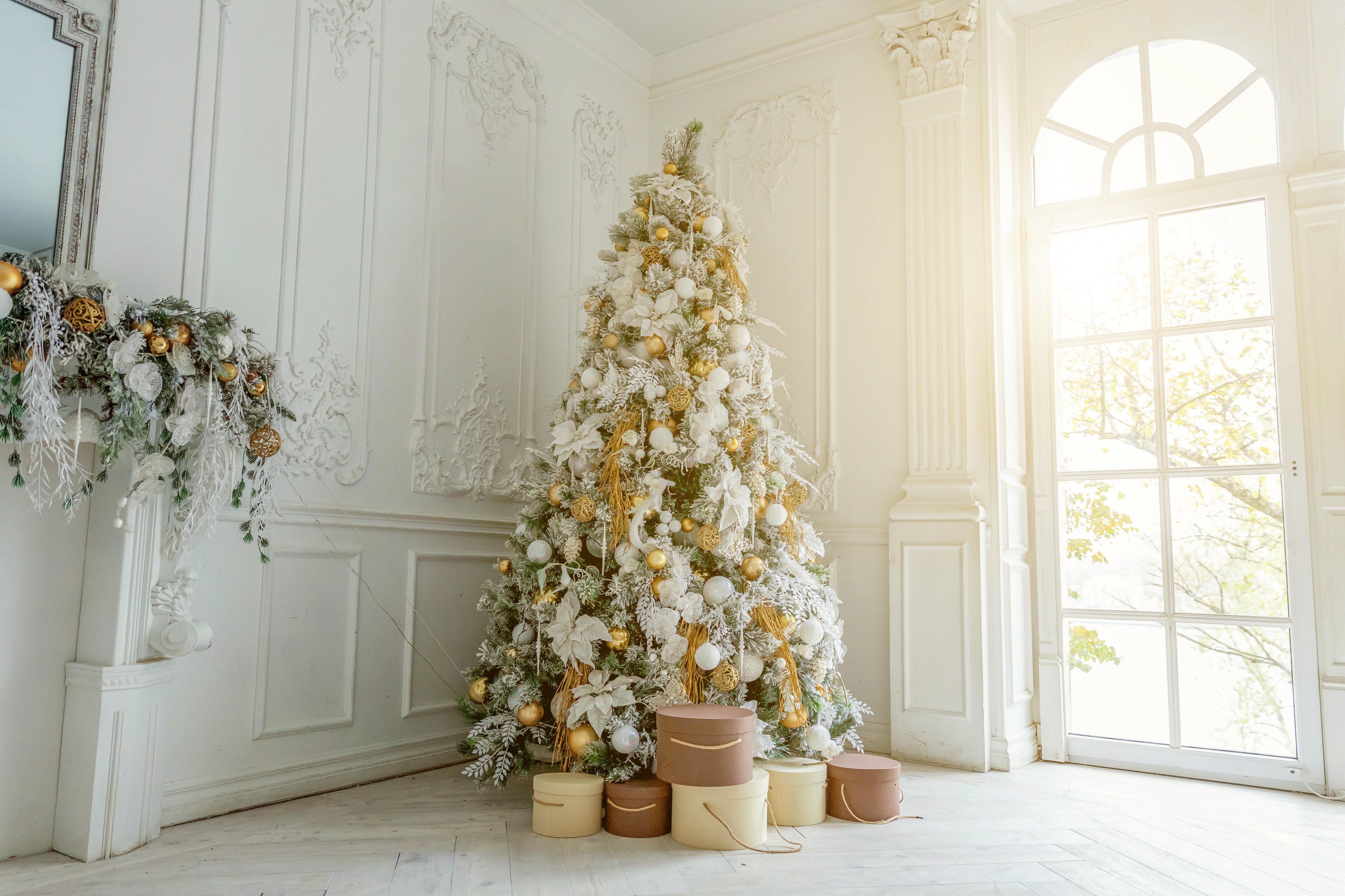 Classic christmas New Year decorated interior room New year tree. Christmas tree with gold decorations. Modern white classical style interior design a