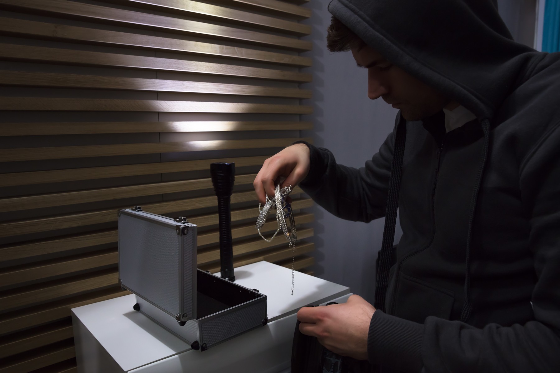 Close-up Of A Thief In Hoodie Stealing Jewelry,Image: 370135751, License: Royalty-free, Restrictions: , Model Release: yes, Credit line: Andriy Popov / Panthermedia / Profimedia