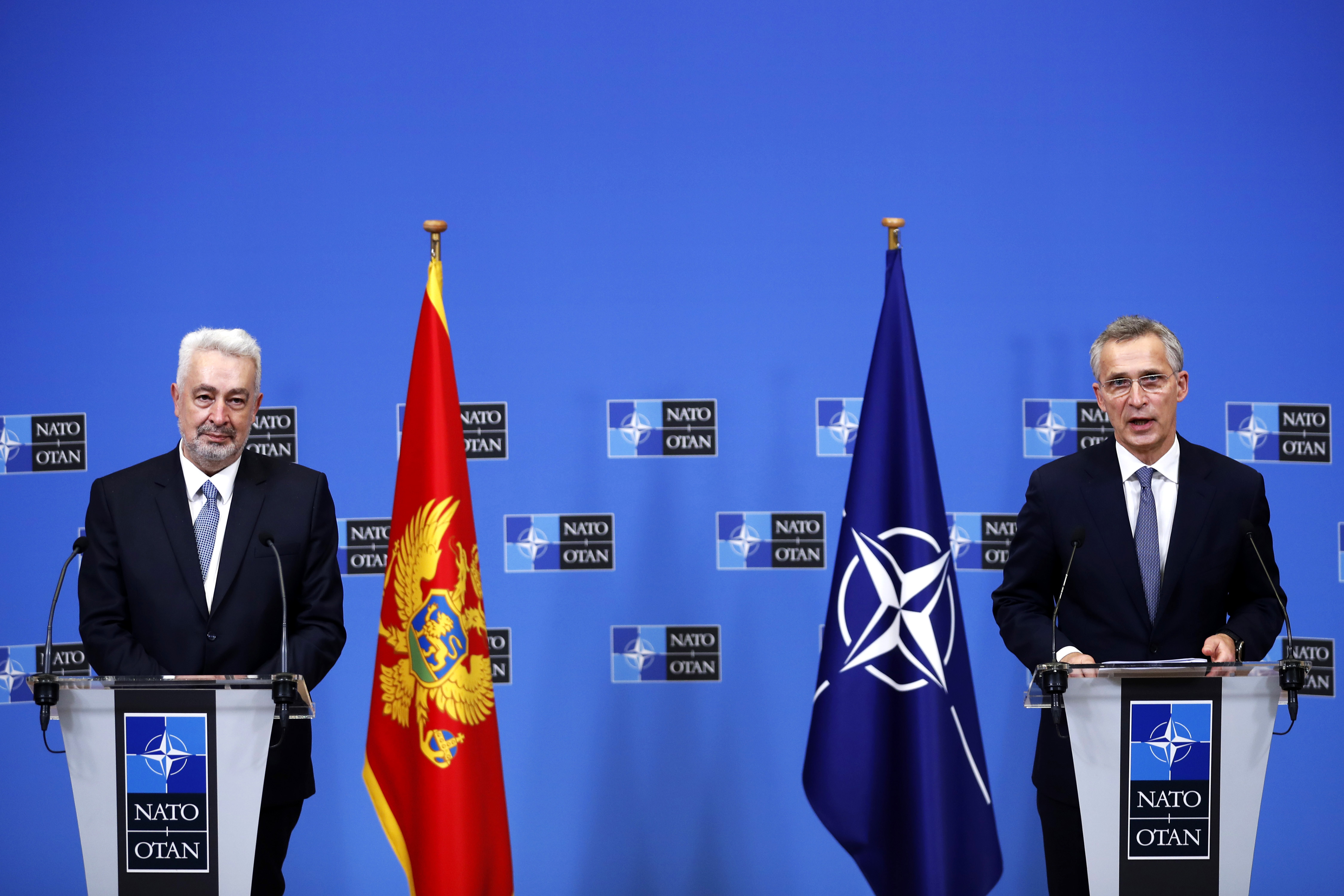 epa08885446 NATO Secretary General Jens Stoltenberg (R) and Montenegro Prime Minister Zdravko Krivokapic (L) give a joint press conference following their talks at the NATO headquarters in Brussels, Belgium, 15 Decmber 2020.  EPA-EFE/Francisco Seco / POOL