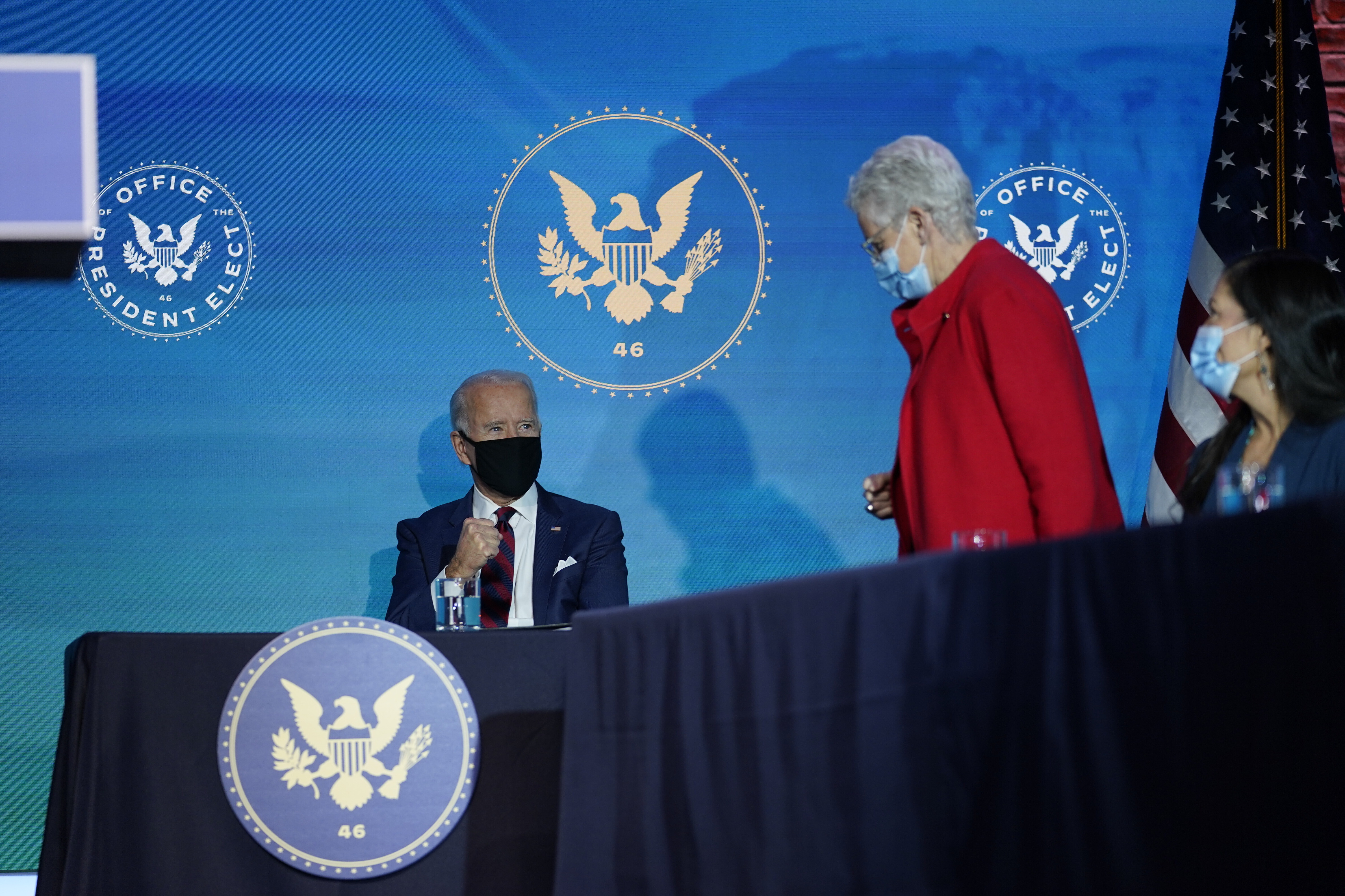President-elect Joe Biden watches as his appointee for National Climate Advisor, Gina McCarthy stands to speak at The Queen Theater in Wilmington Del., Saturday, Dec. 19, 2020. (AP Photo/Carolyn Kaster)