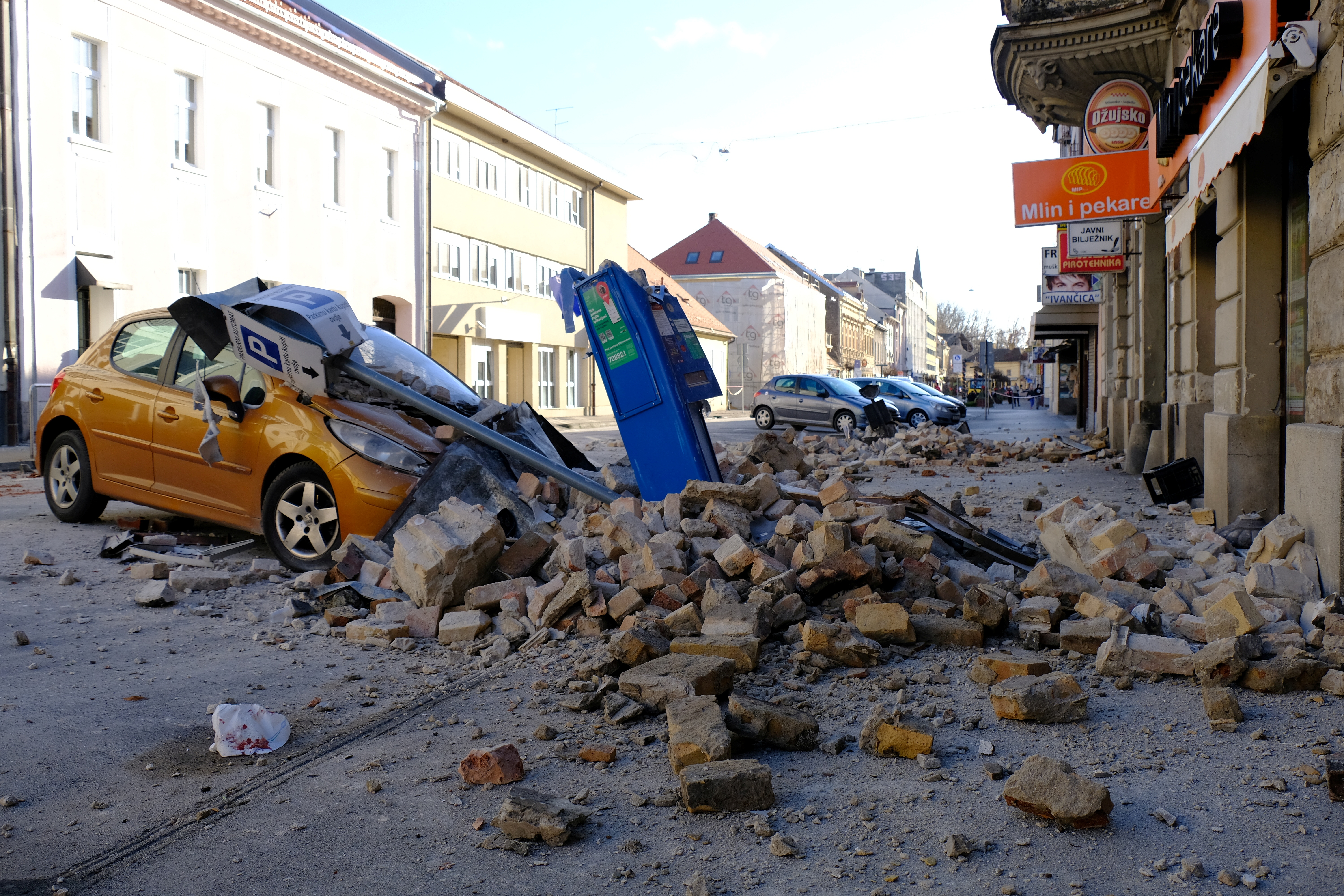 A destroyed car is seen on a street after an earthquake in Sisak, Croatia December 29, 2020. Slaven Branislav Babic/PIXSELL via REUTERS ATTENTION EDITORS - THIS IMAGE WAS PROVIDED BY A THIRD PARTY. CROATIA OUT. NO RESALES. NO ARCHIVES.