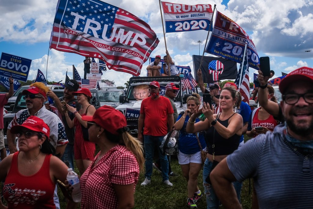 epa08756457 Demonstrators participate in 'Latinos for Trump' demonstration, a parade in support of US President Donald J. Trump, at Tamiami Park in Miami, USA, 18 October 2020.  EPA-EFE/MARIO CRUZ